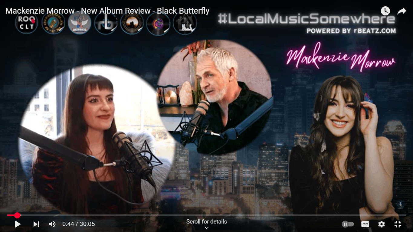 a video with two people in front of a microphone