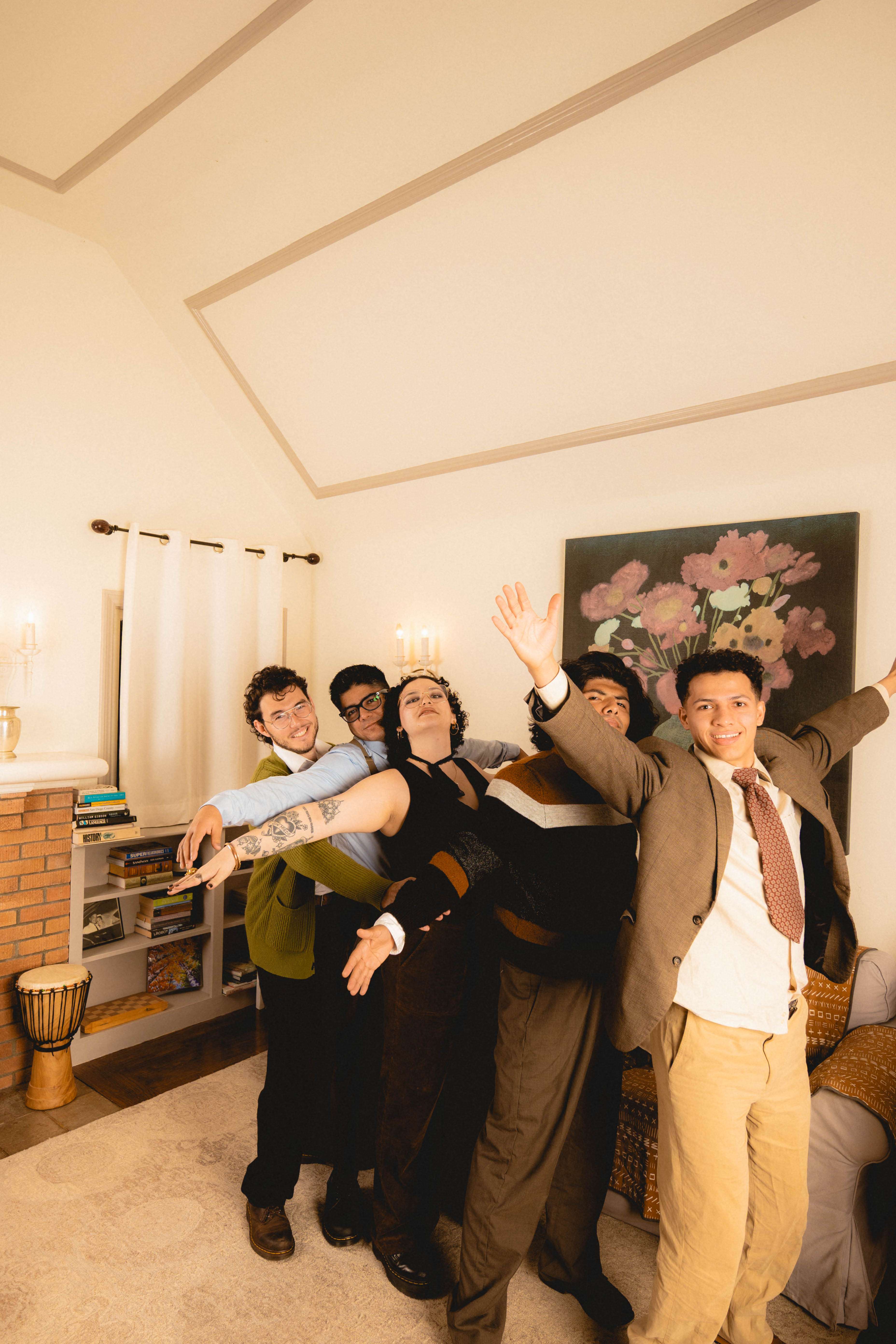 a group of people posing in a living room