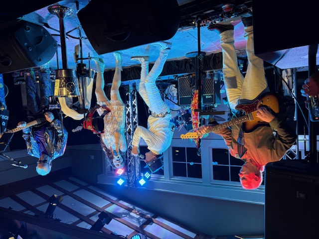 a group of people playing music in a room