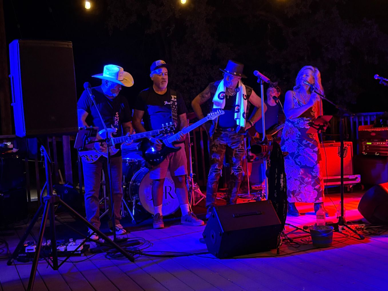 a group of people playing music on a deck