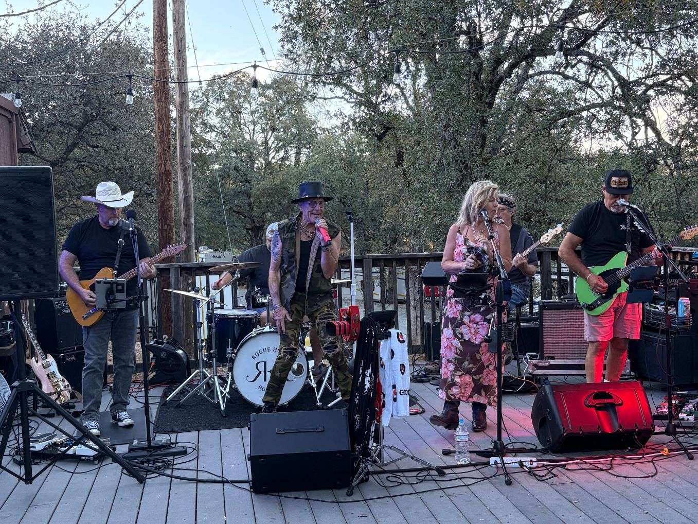 a group of people playing music on a deck