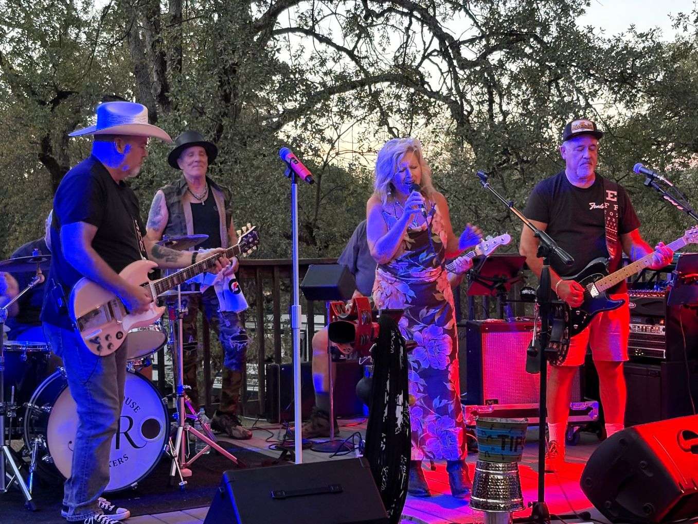 a group of people playing music on a stage