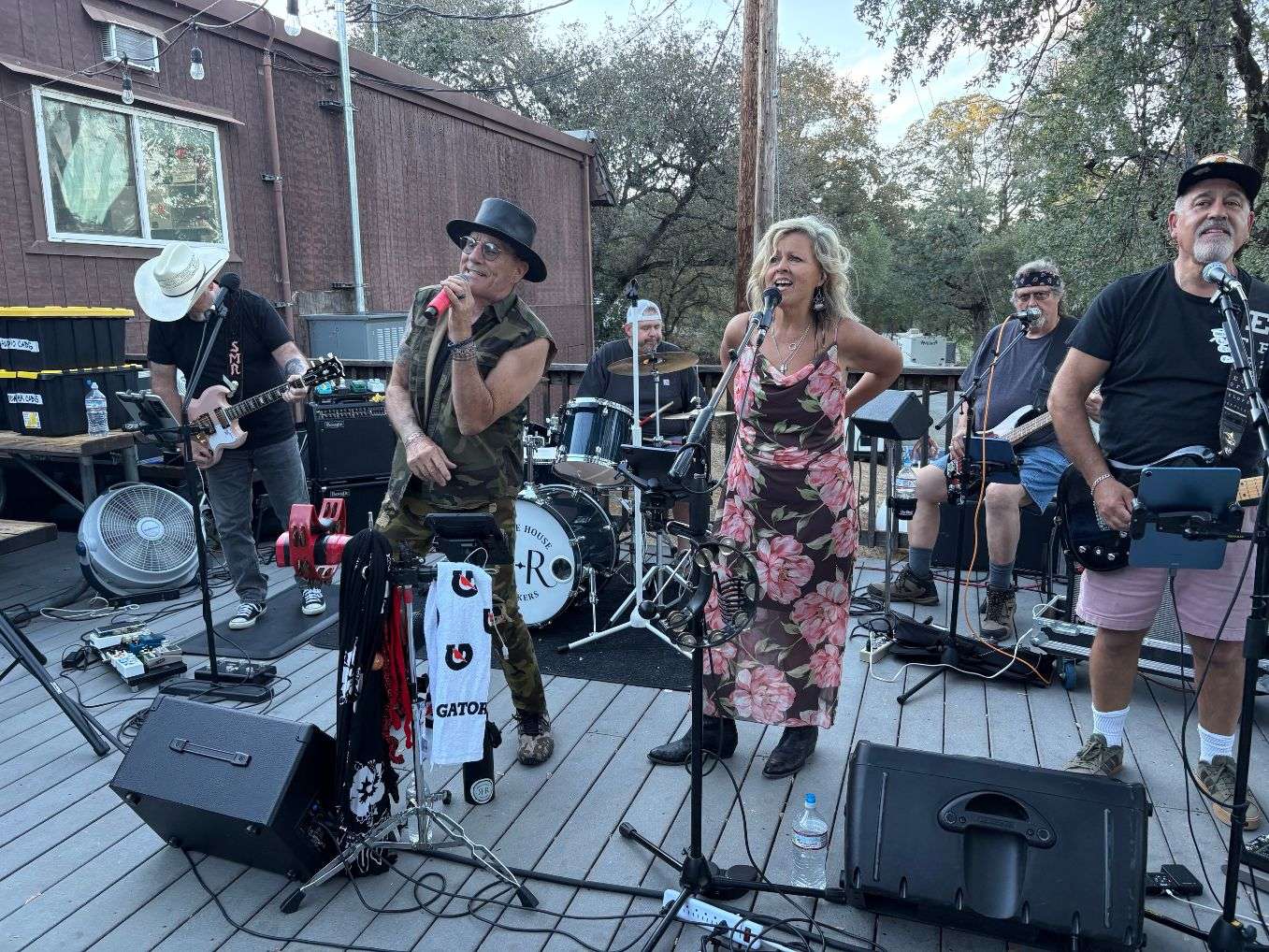 a group of people playing music on a deck