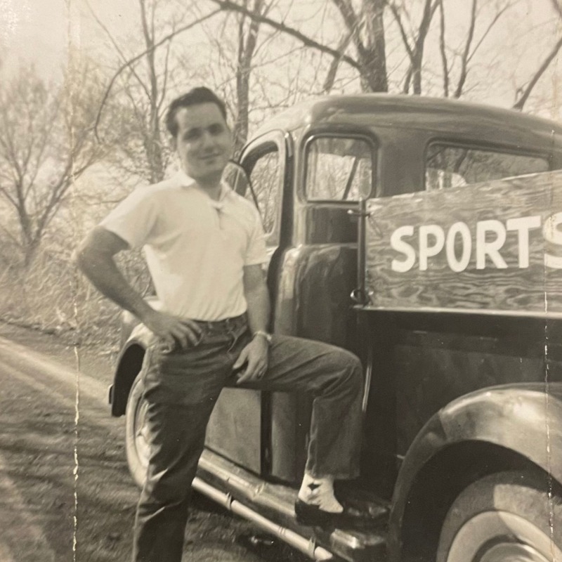 a man leaning against a truck