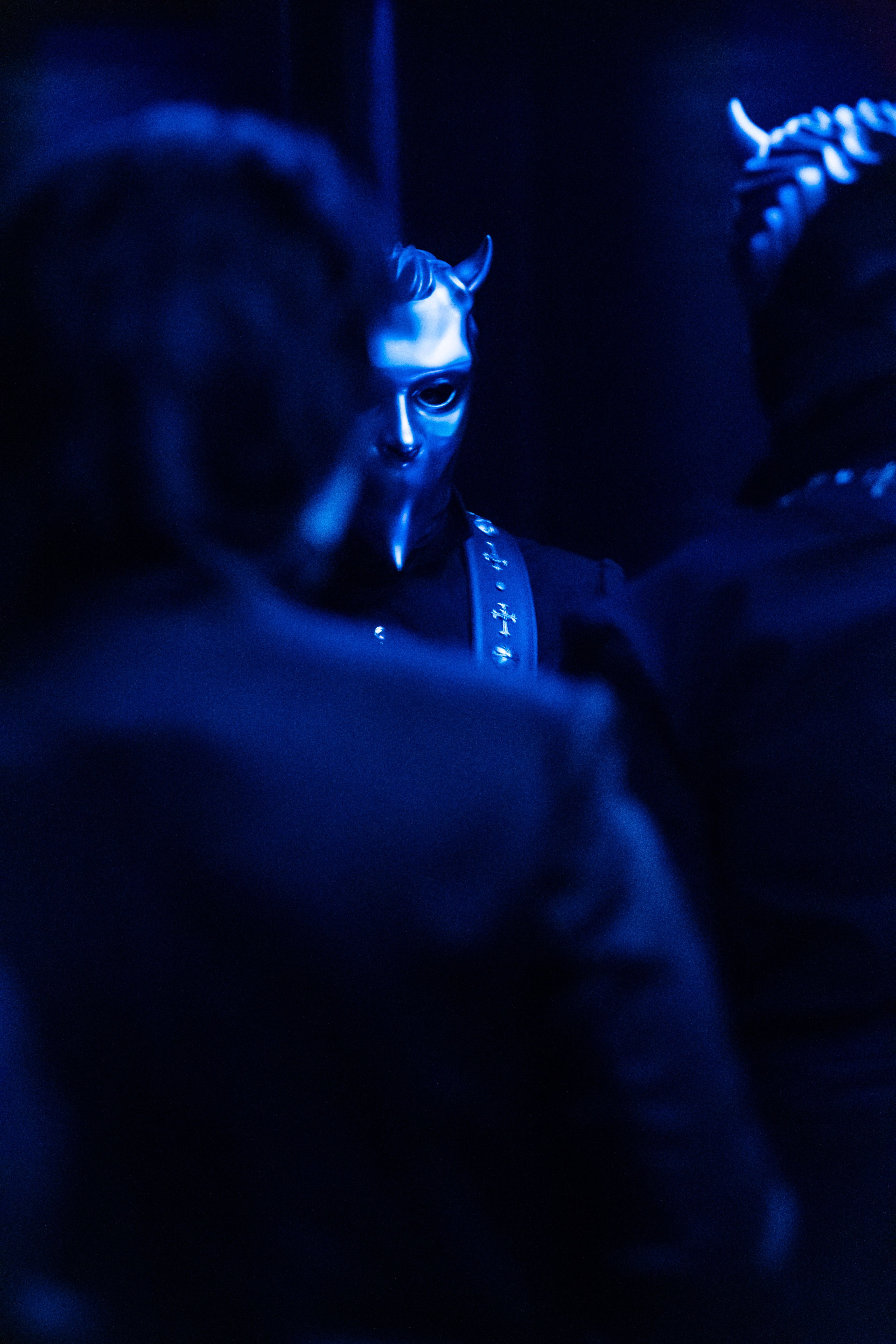 a group of people standing in a dark room