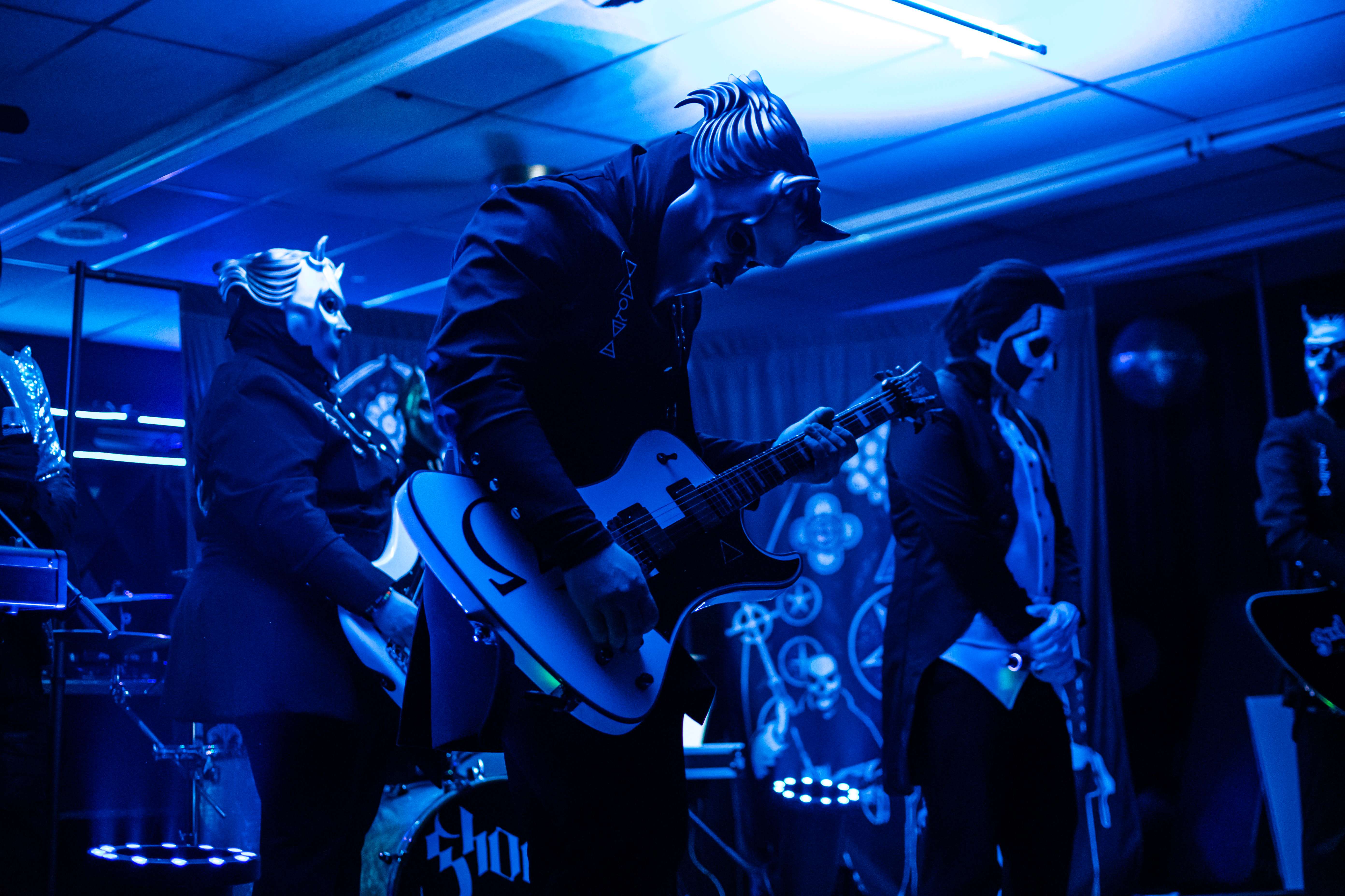 a group of people playing music in a room