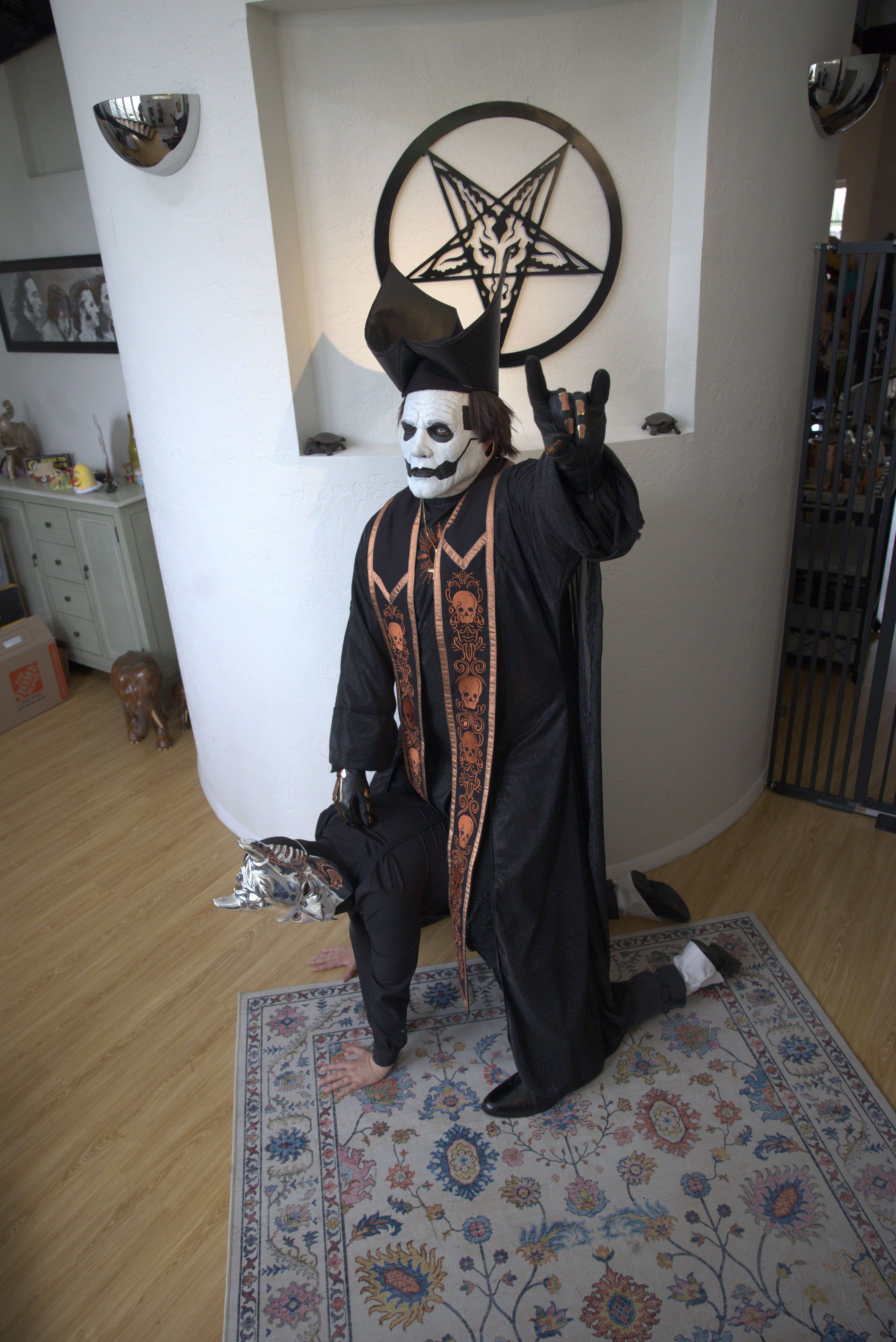 a man dressed as a skeleton is posing for a picture
