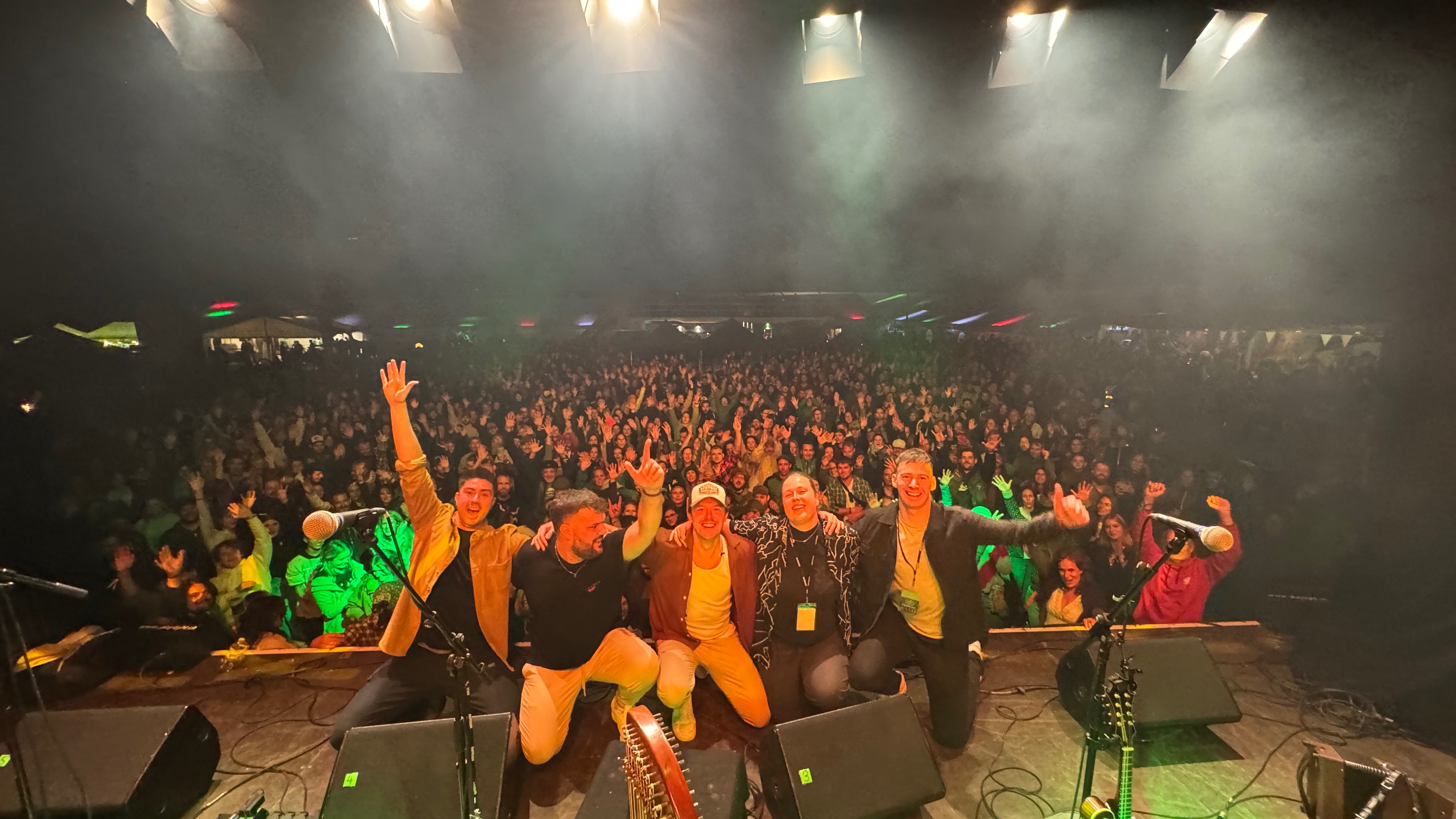 a group of people on stage at a concert
