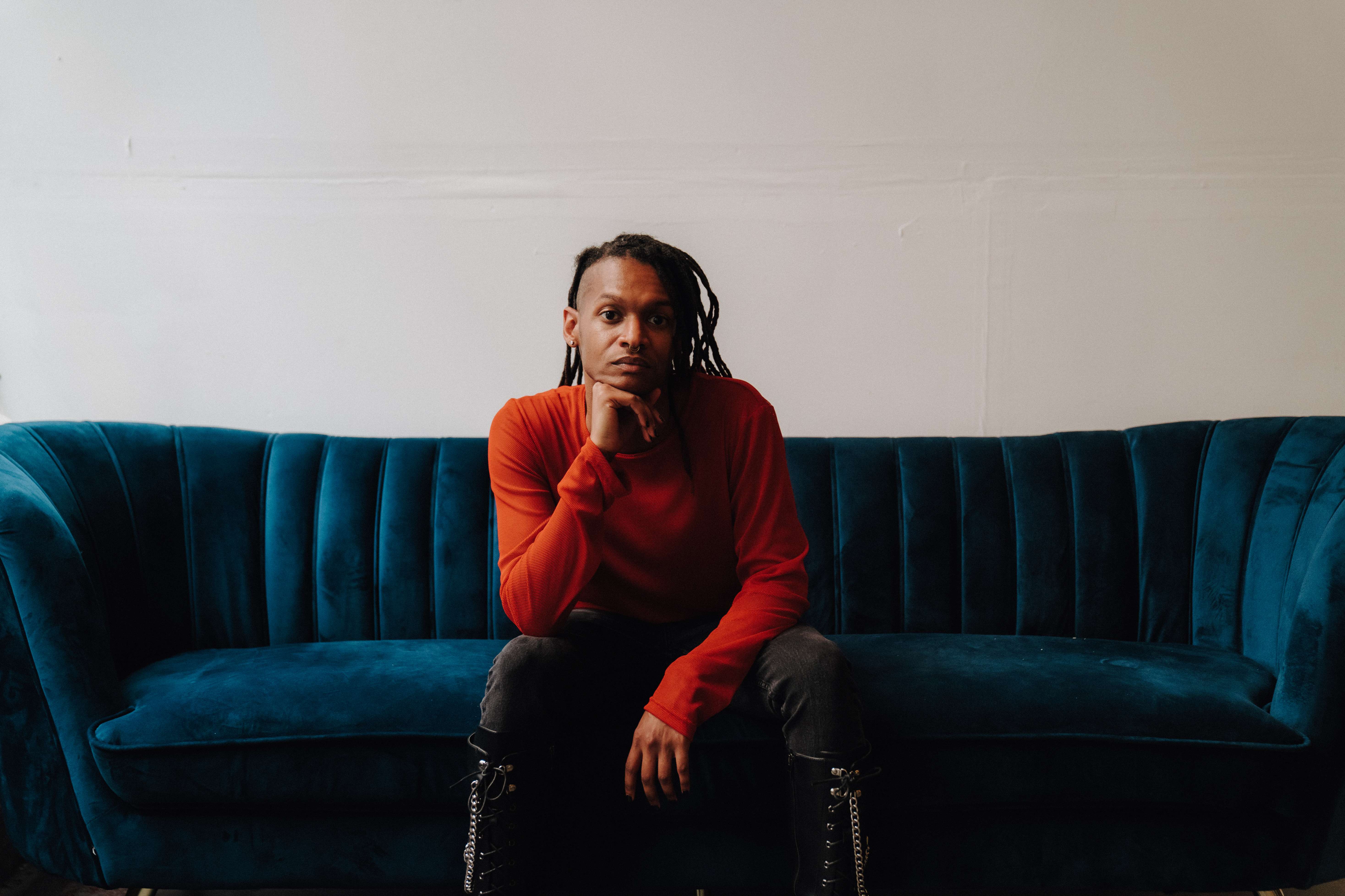 a woman sitting on a blue couch