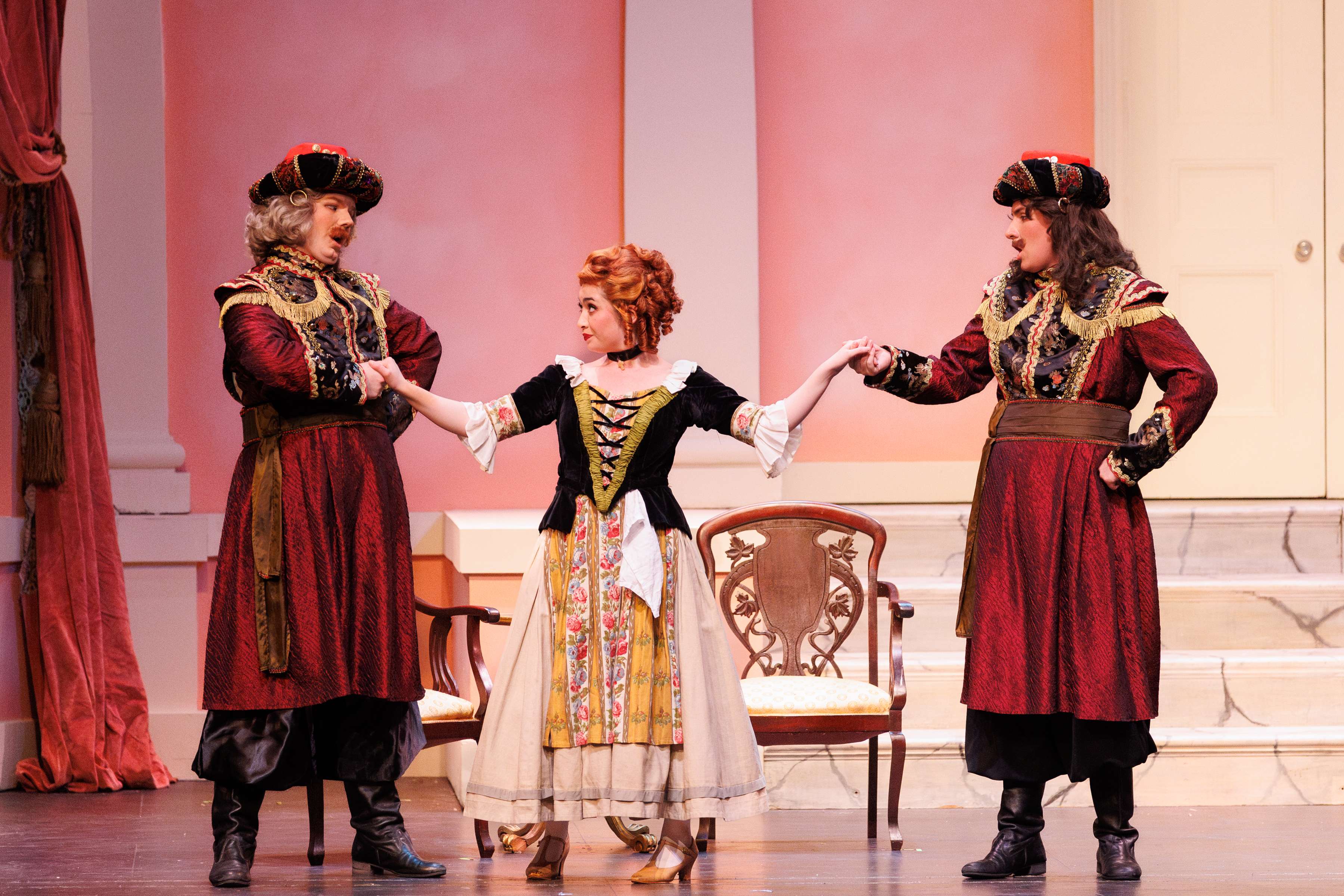 a group of people in costumes on a stage