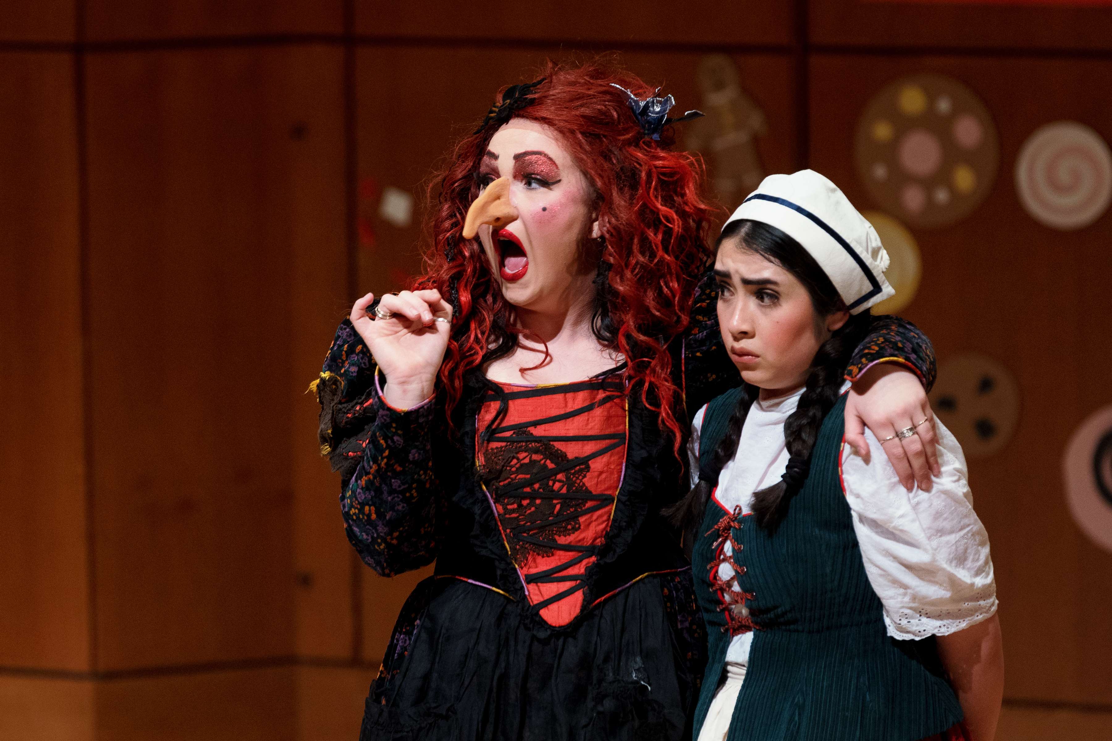 two women dressed in costumes are standing next to each other