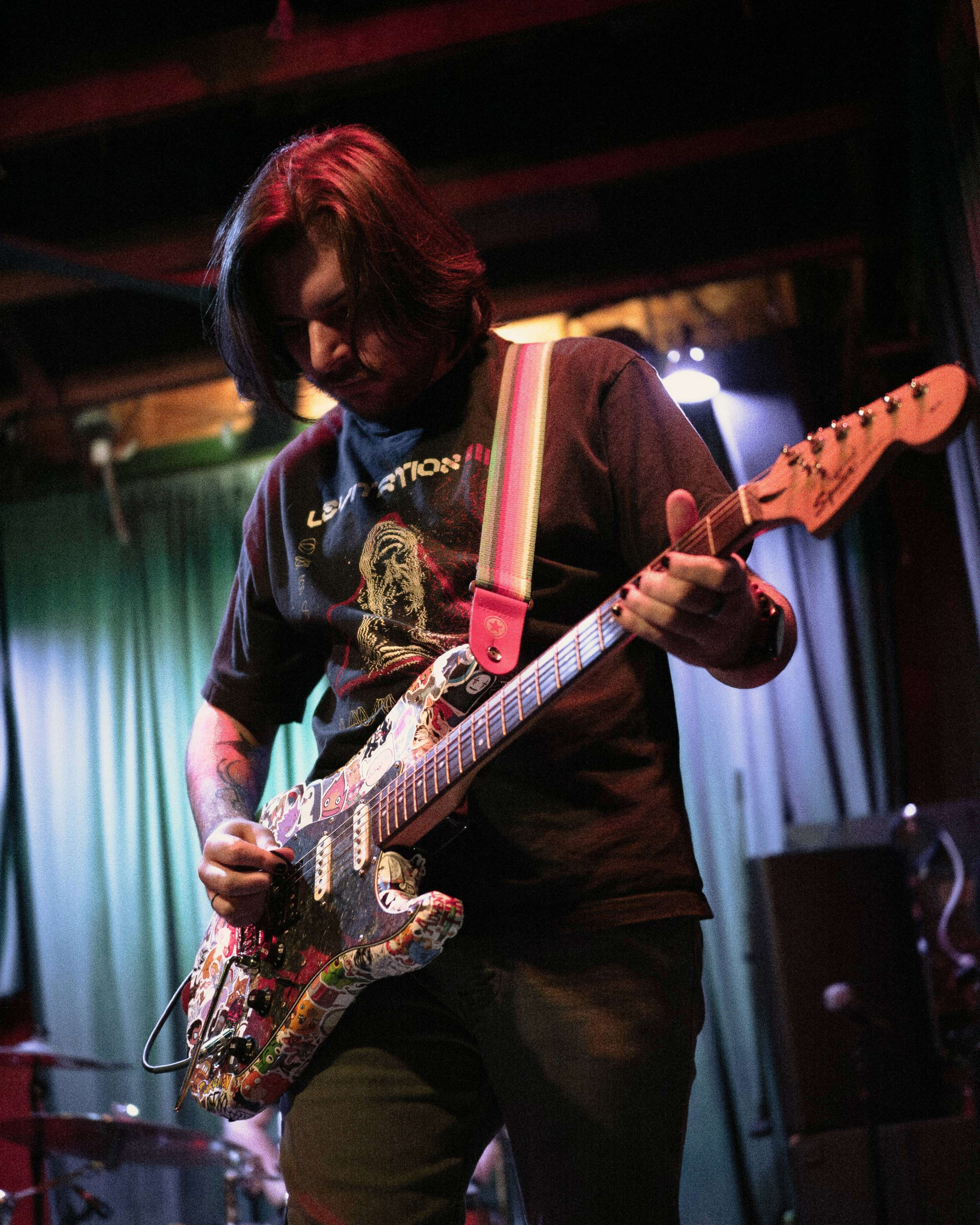 a man playing an electric guitar