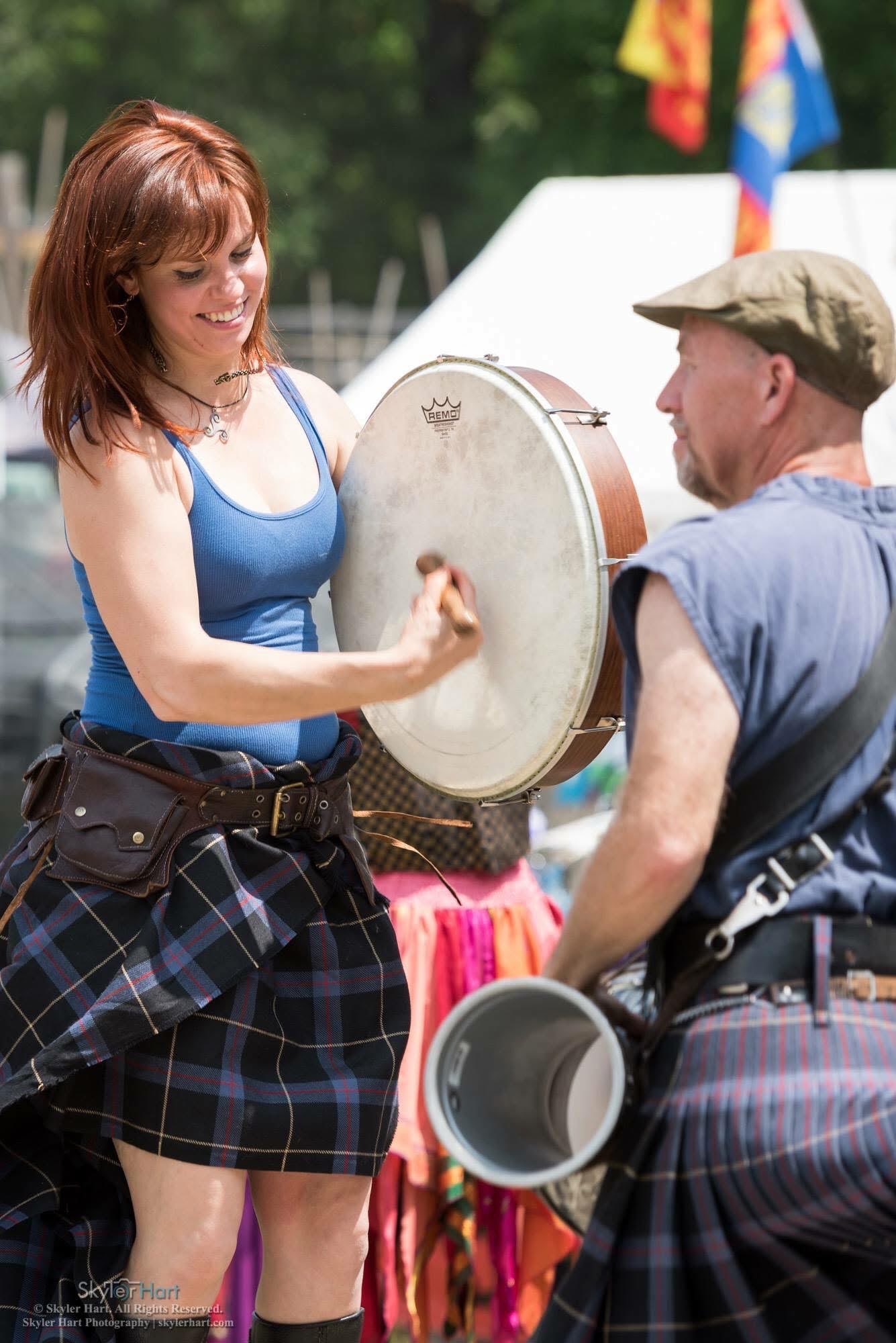 a woman wearing a plaid skirt