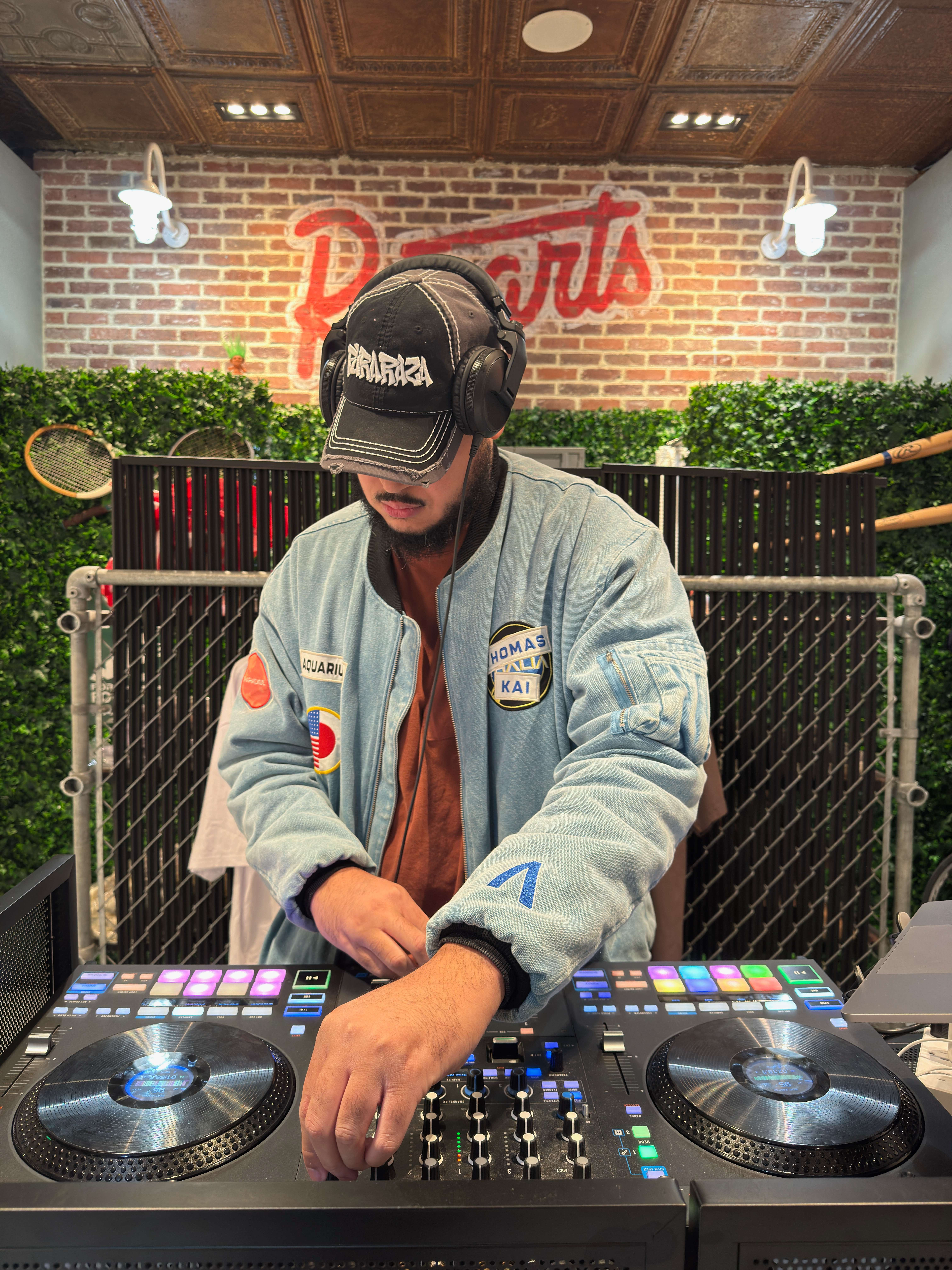 a man is djing at a store