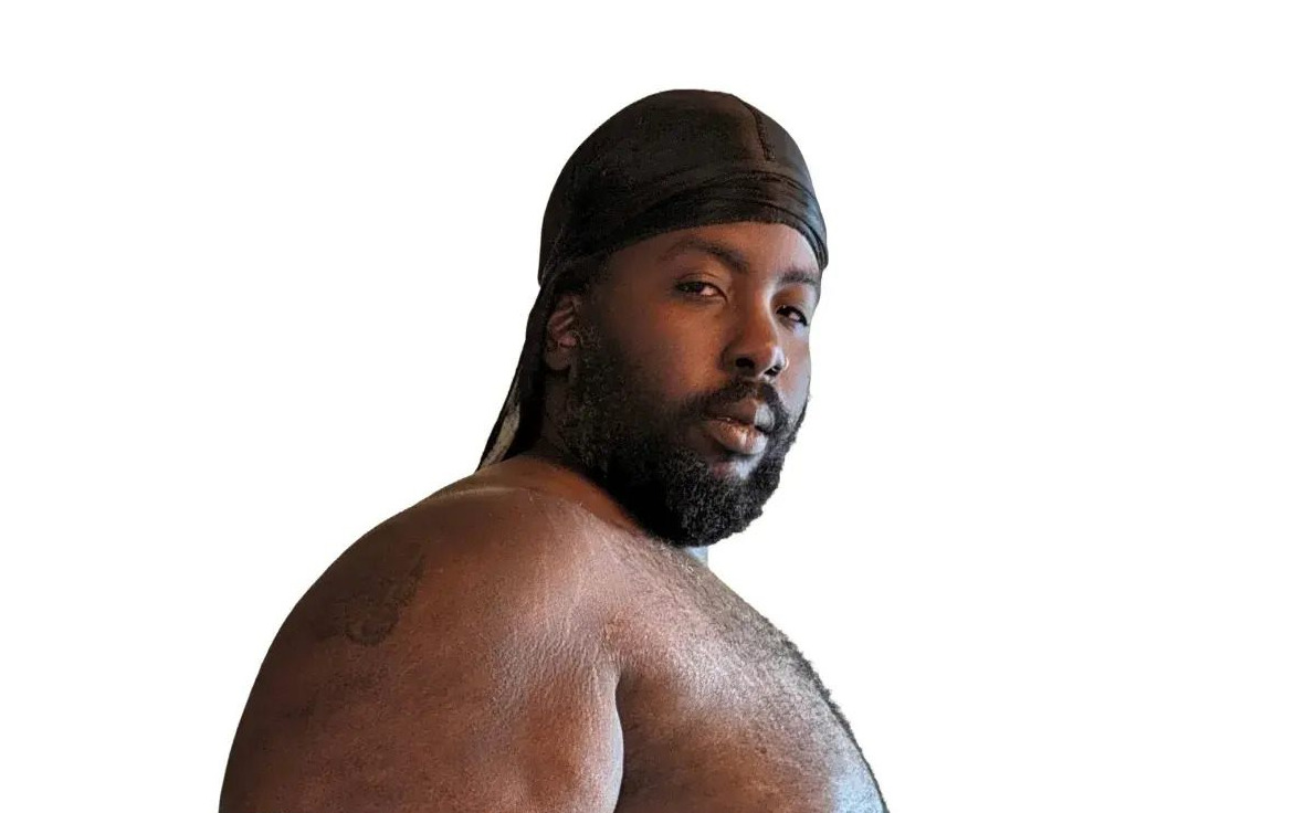 a black man with a beard and a turban
