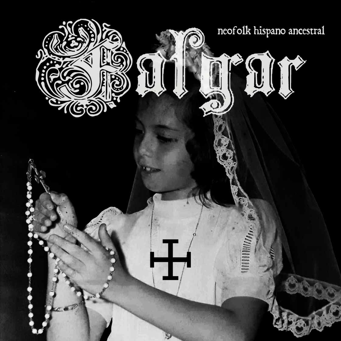 a black and white photo of a young girl wearing a veil