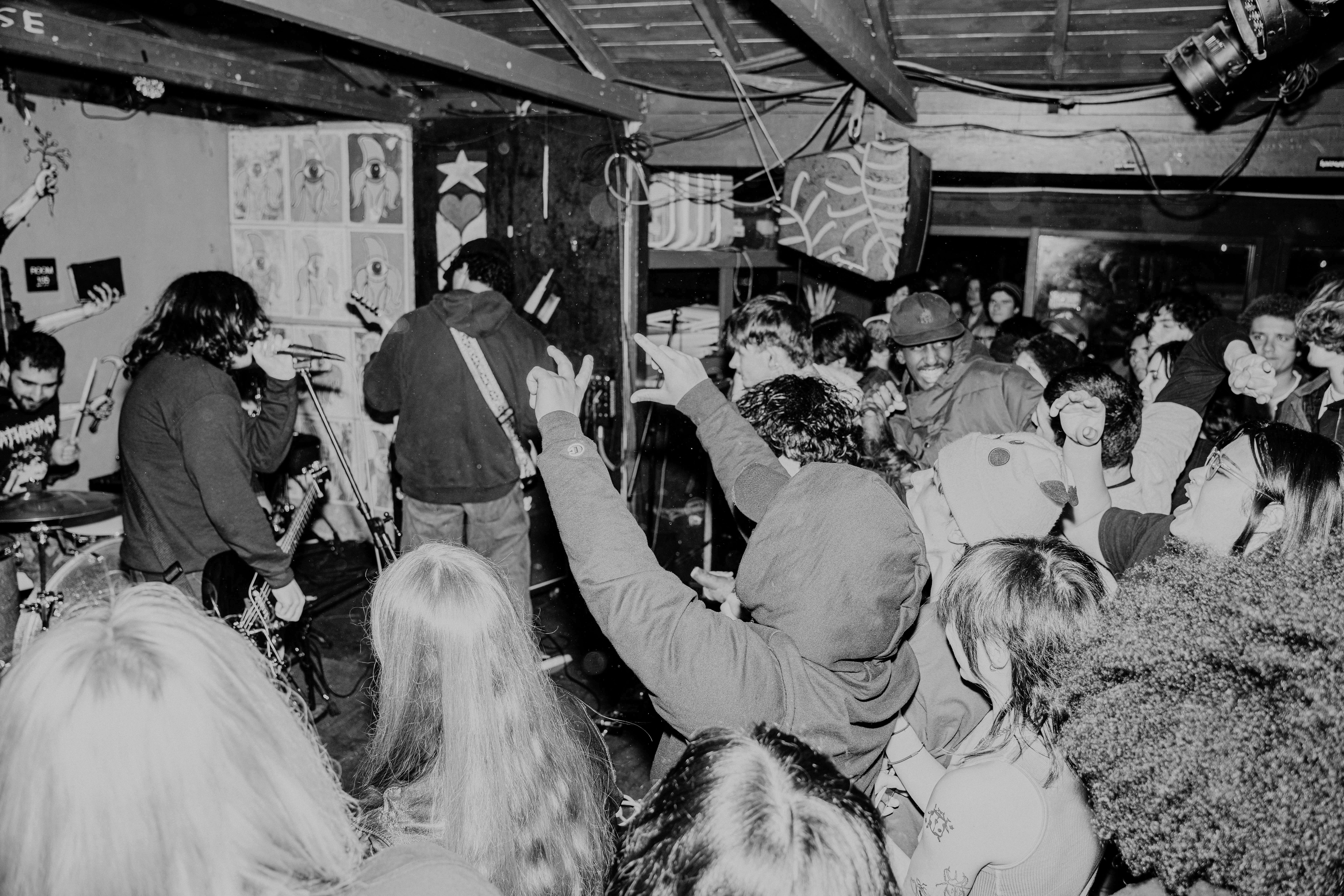 a black and white photo of a crowd at a concert