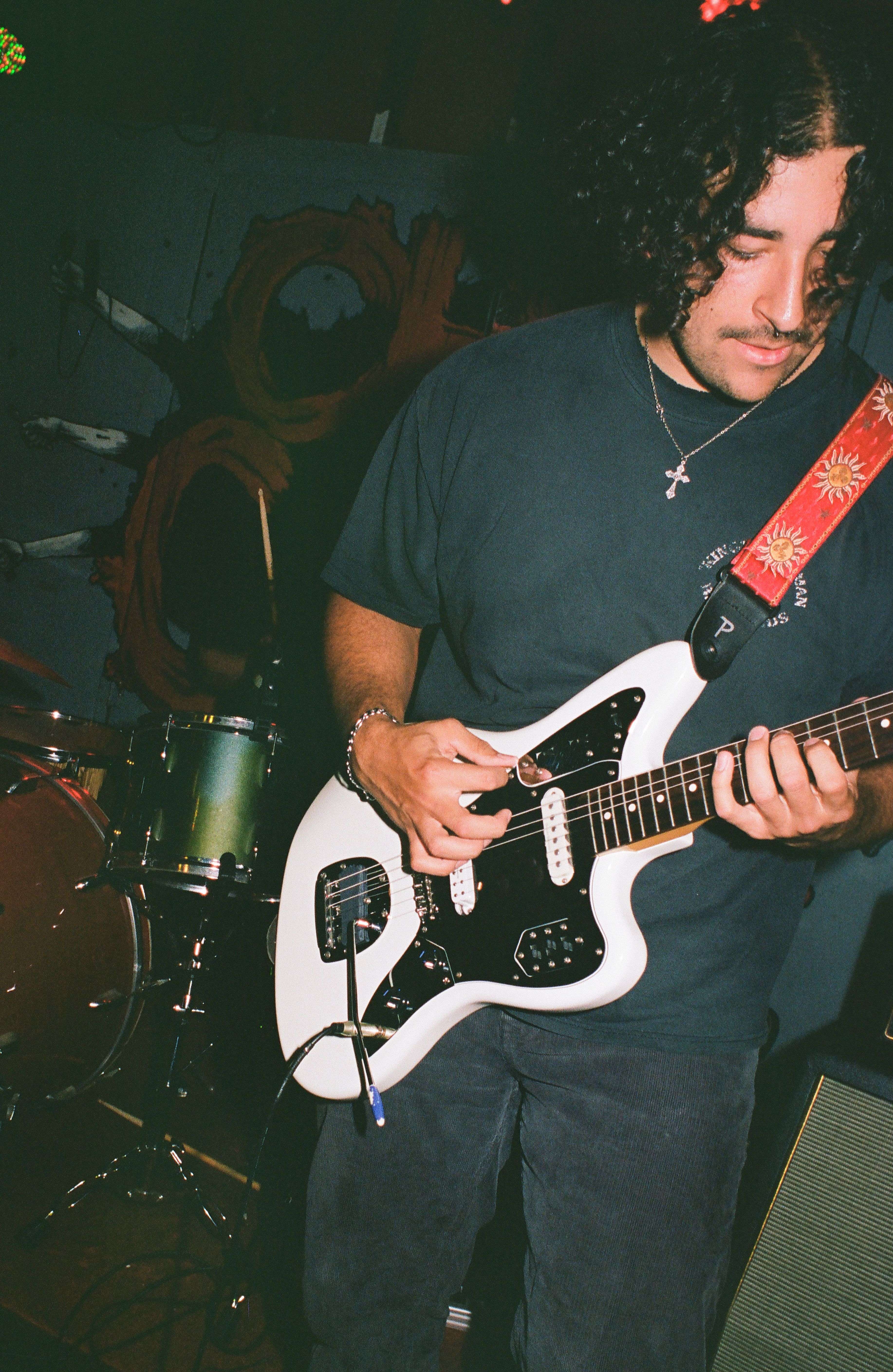 a man playing a guitar