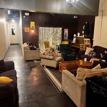 a living room with couches and a coffee table