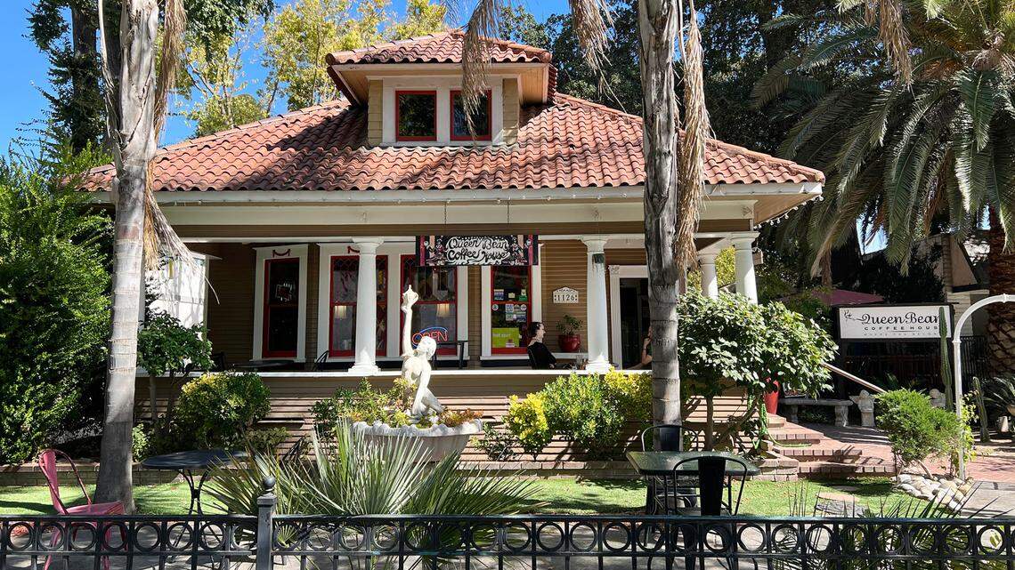 a house with a palm tree in front of it