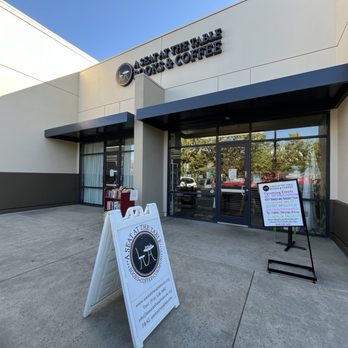 the front of a building with a sign in front of it