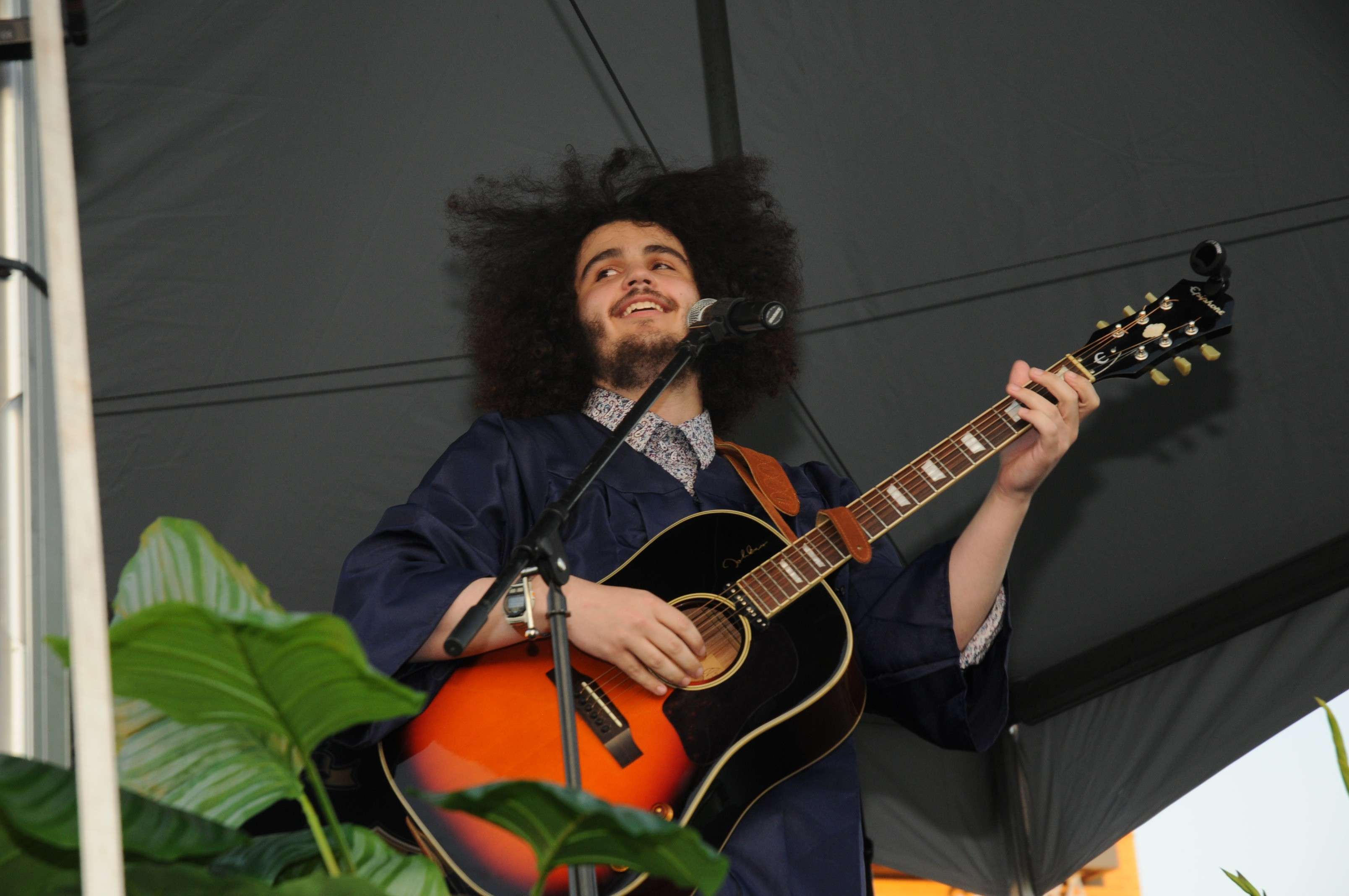 a man playing an acoustic guitar