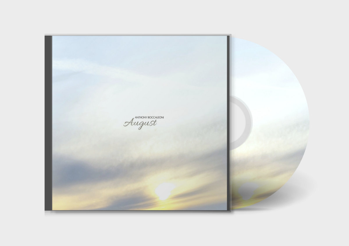 a cd with an image of a sunset and clouds