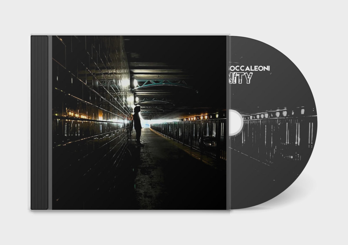 a black cd with a picture of a man in a subway station