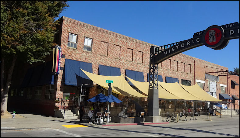 a brick building with awnings on the side of it