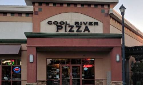 a restaurant with a sign that says cool river pizza