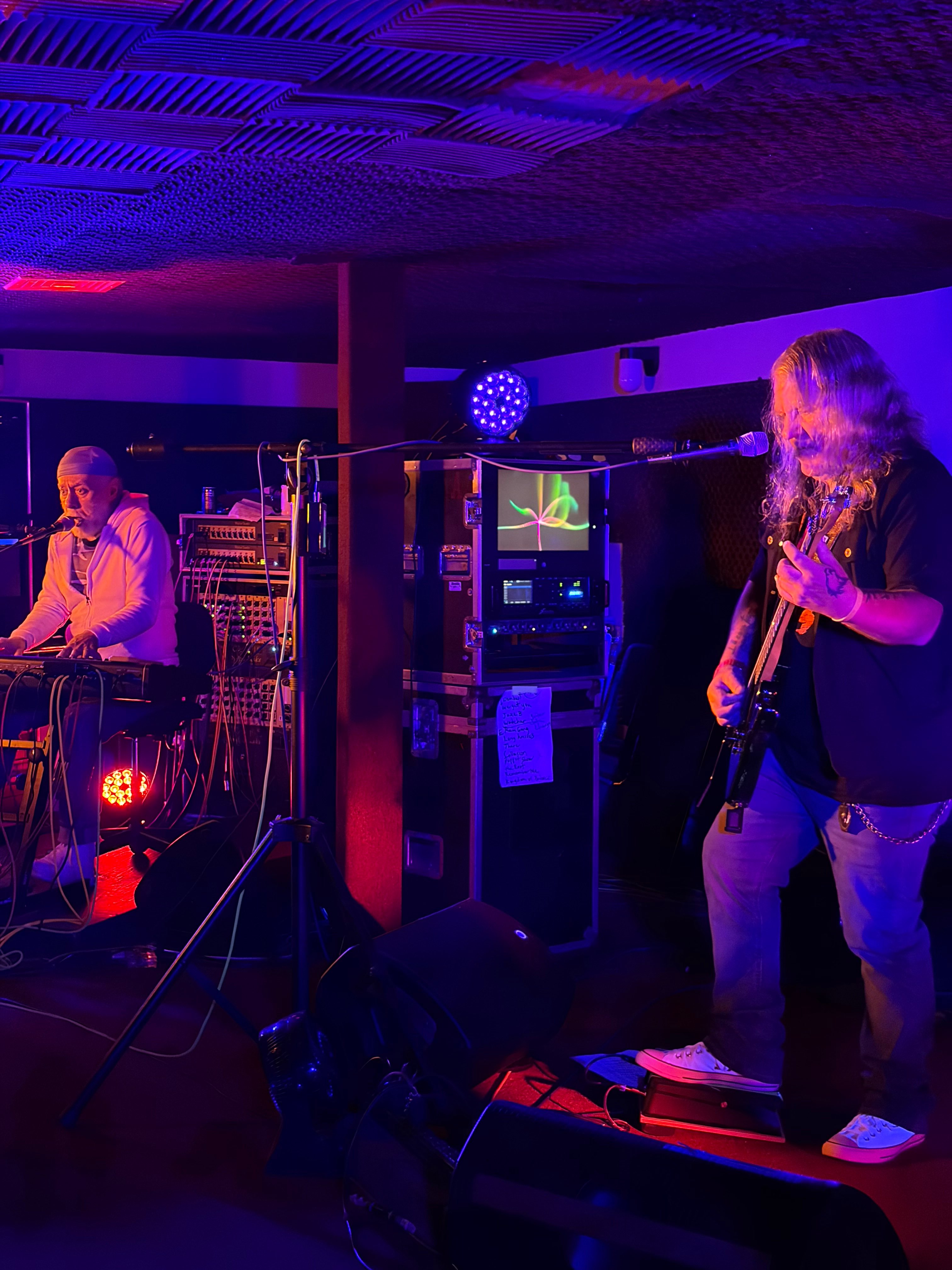 a group of people playing music in a room