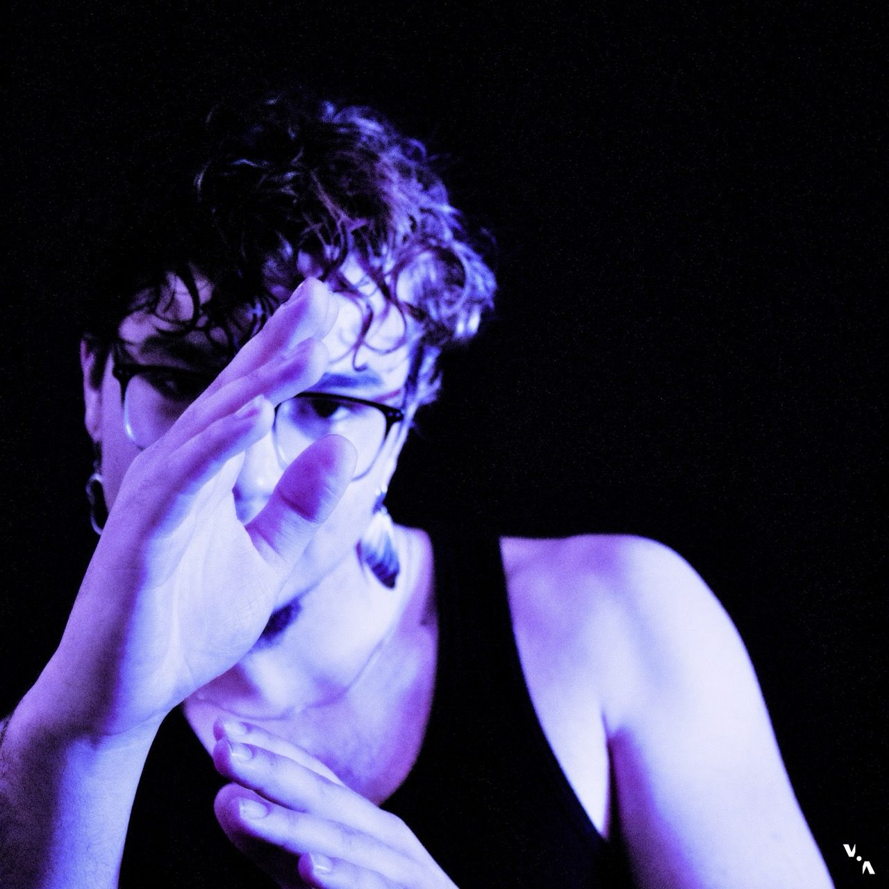 Between - SWEAT: a man wearing a tank top