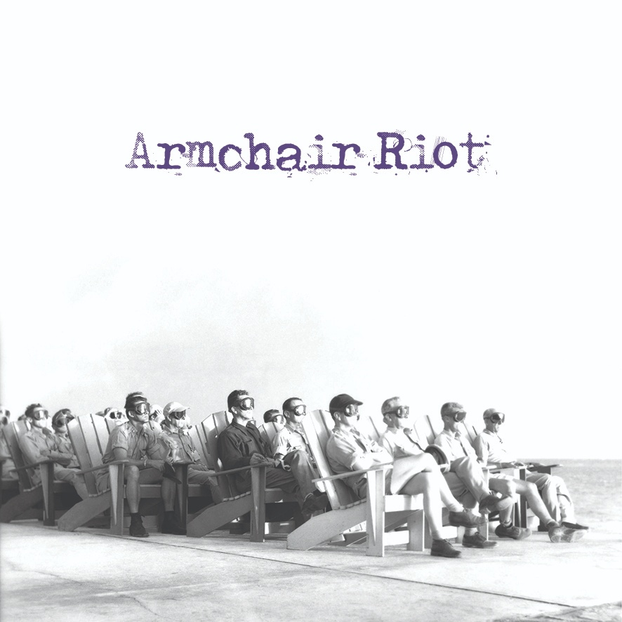 a black and white photo of a group of people sitting on chairs