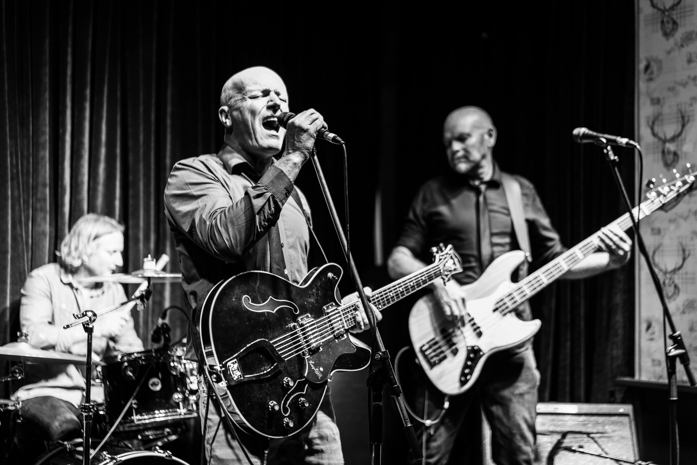 image may contain person, on stage, playing a musical instrument and night