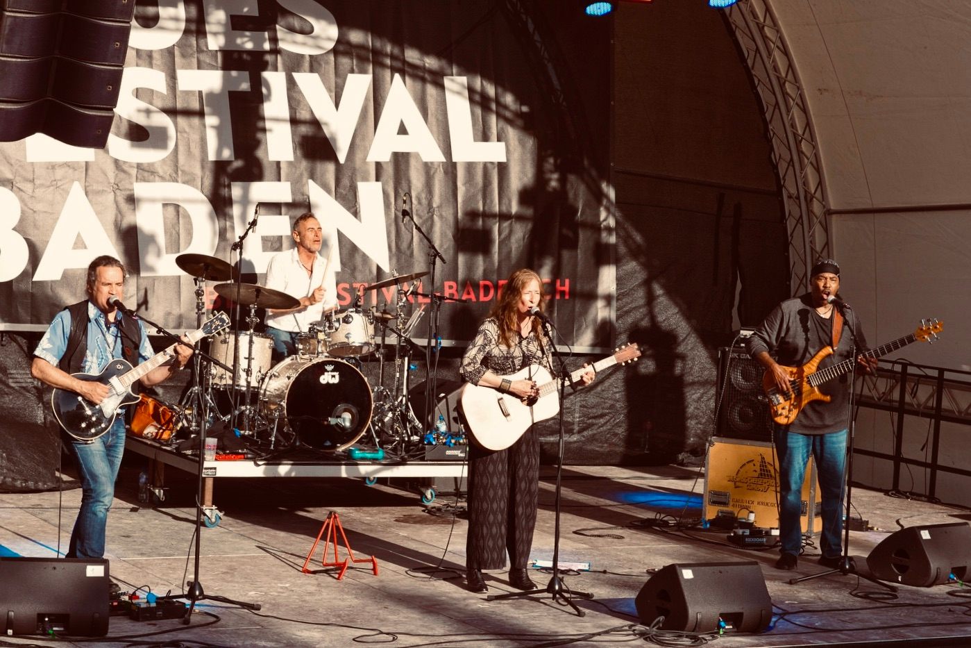 a group of people on stage at a festival