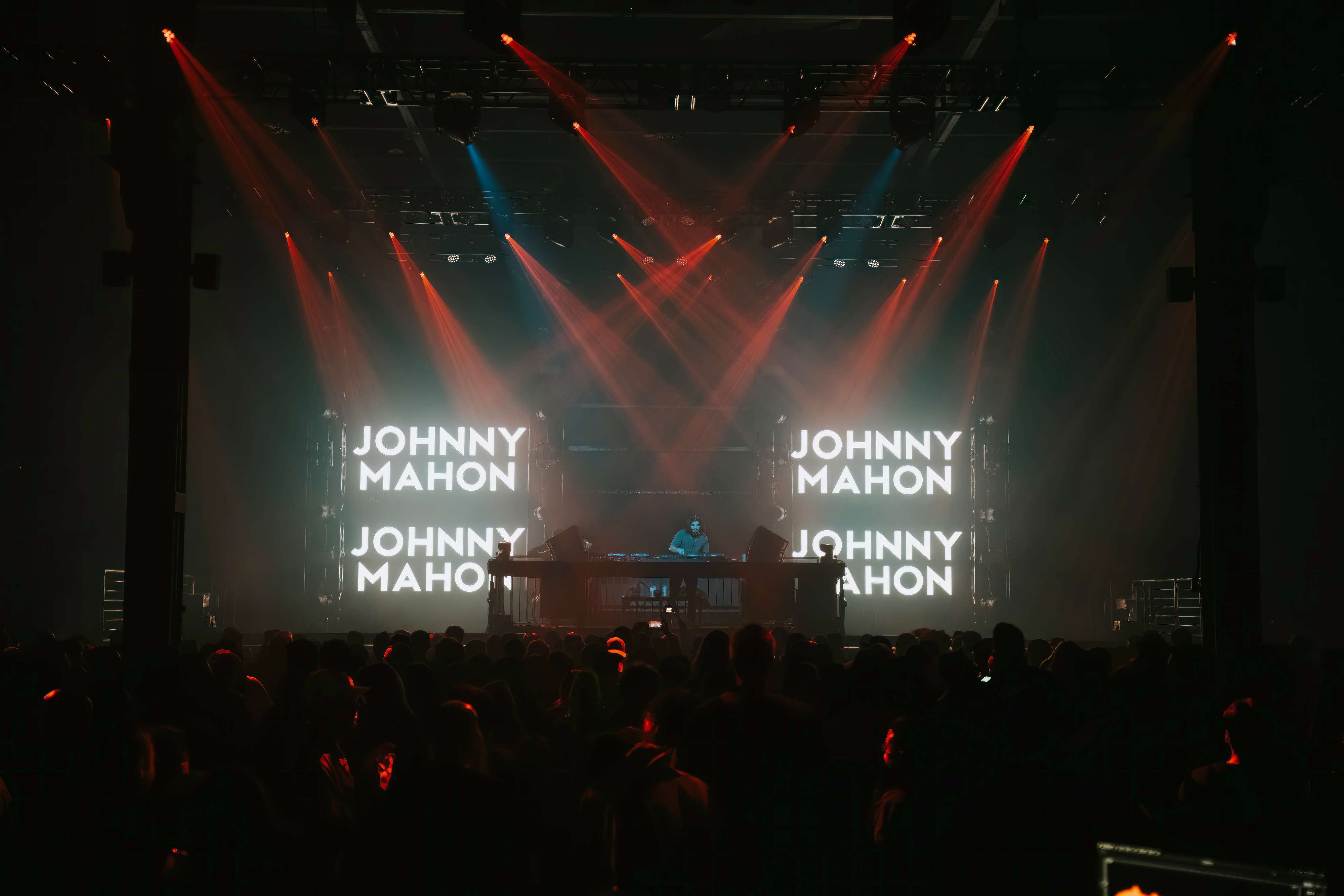 dj johnny mason on stage at a concert