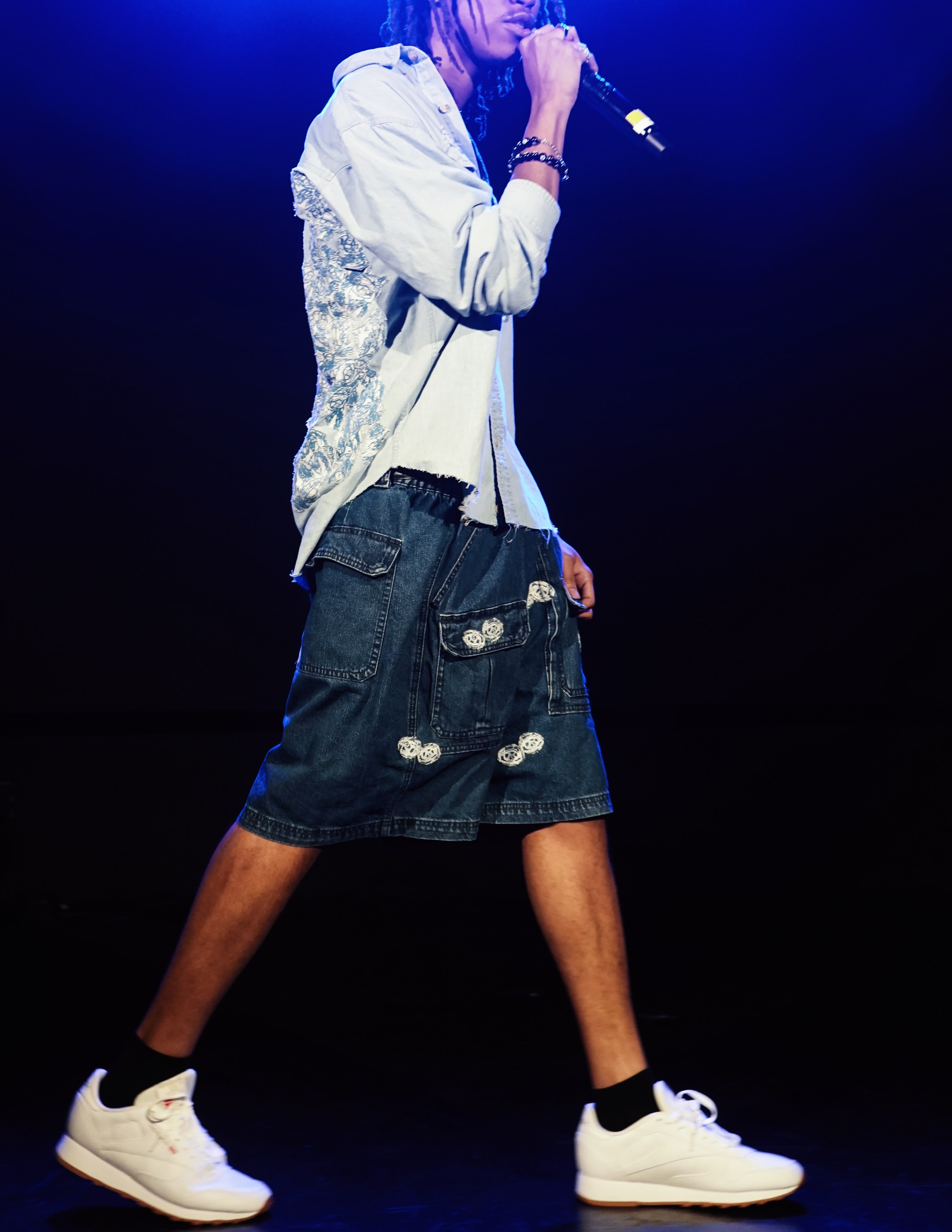 a man is holding a microphone