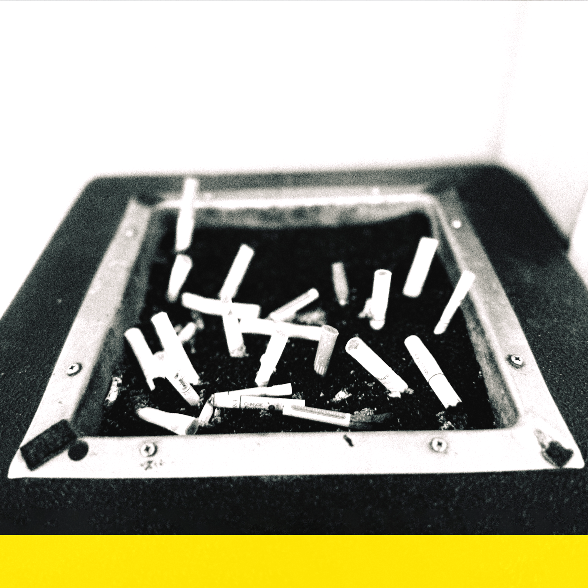 a black and white photo of a cigarette ashtray