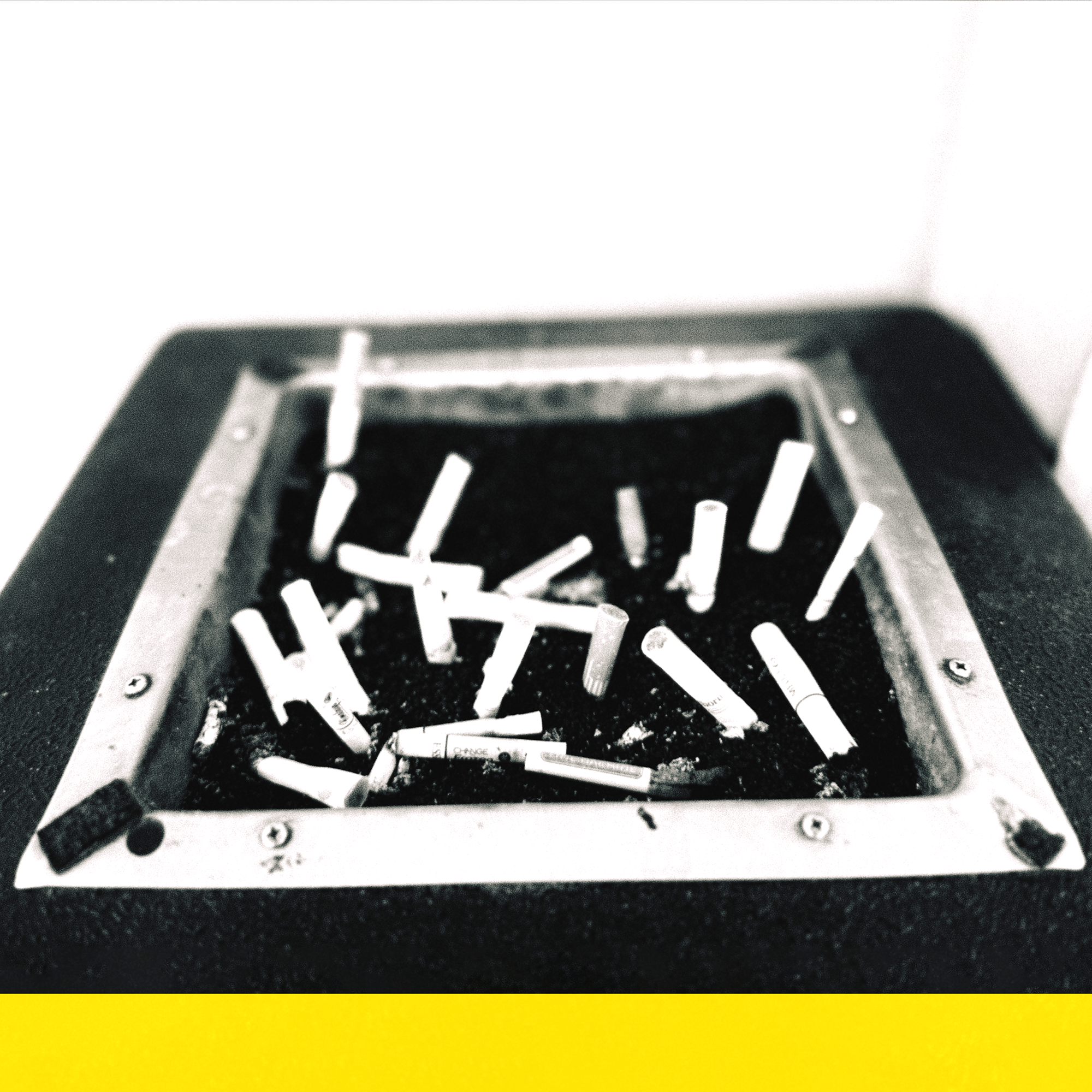 a black and white photo of a cigarette ashtray