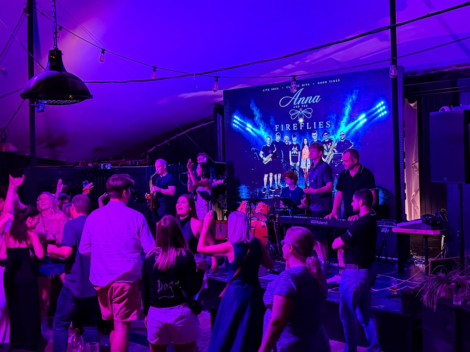 a group of people at a party in a tent