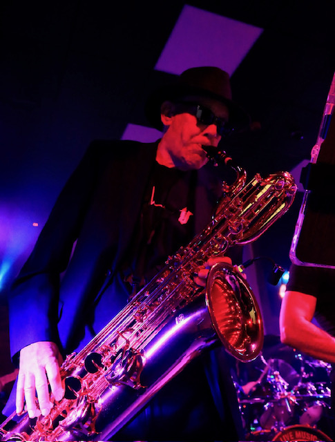 a man is playing a saxophone