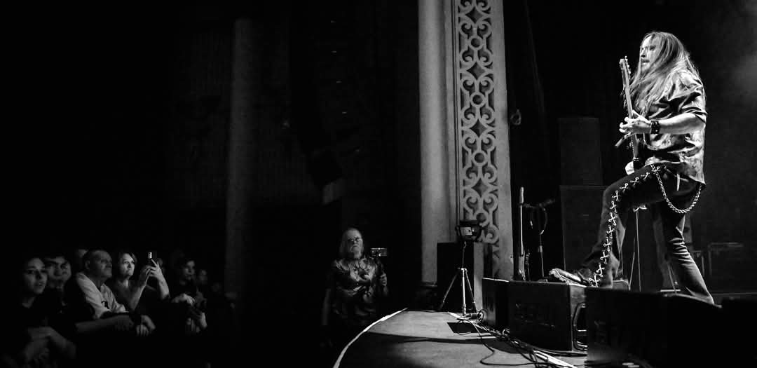 a black and white photo of a person on stage