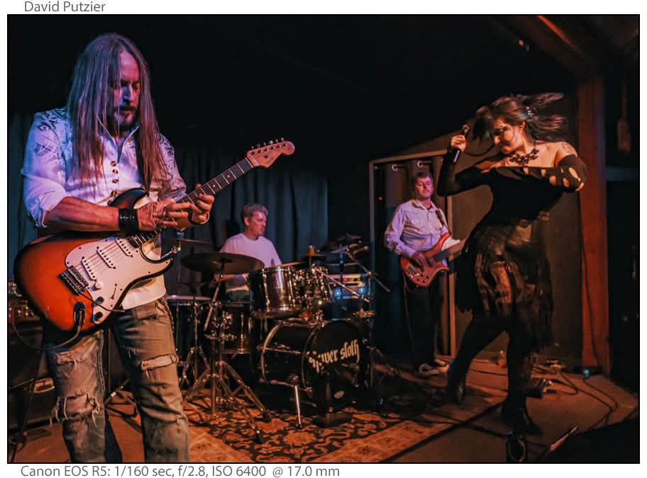a group of people playing guitars in a band
