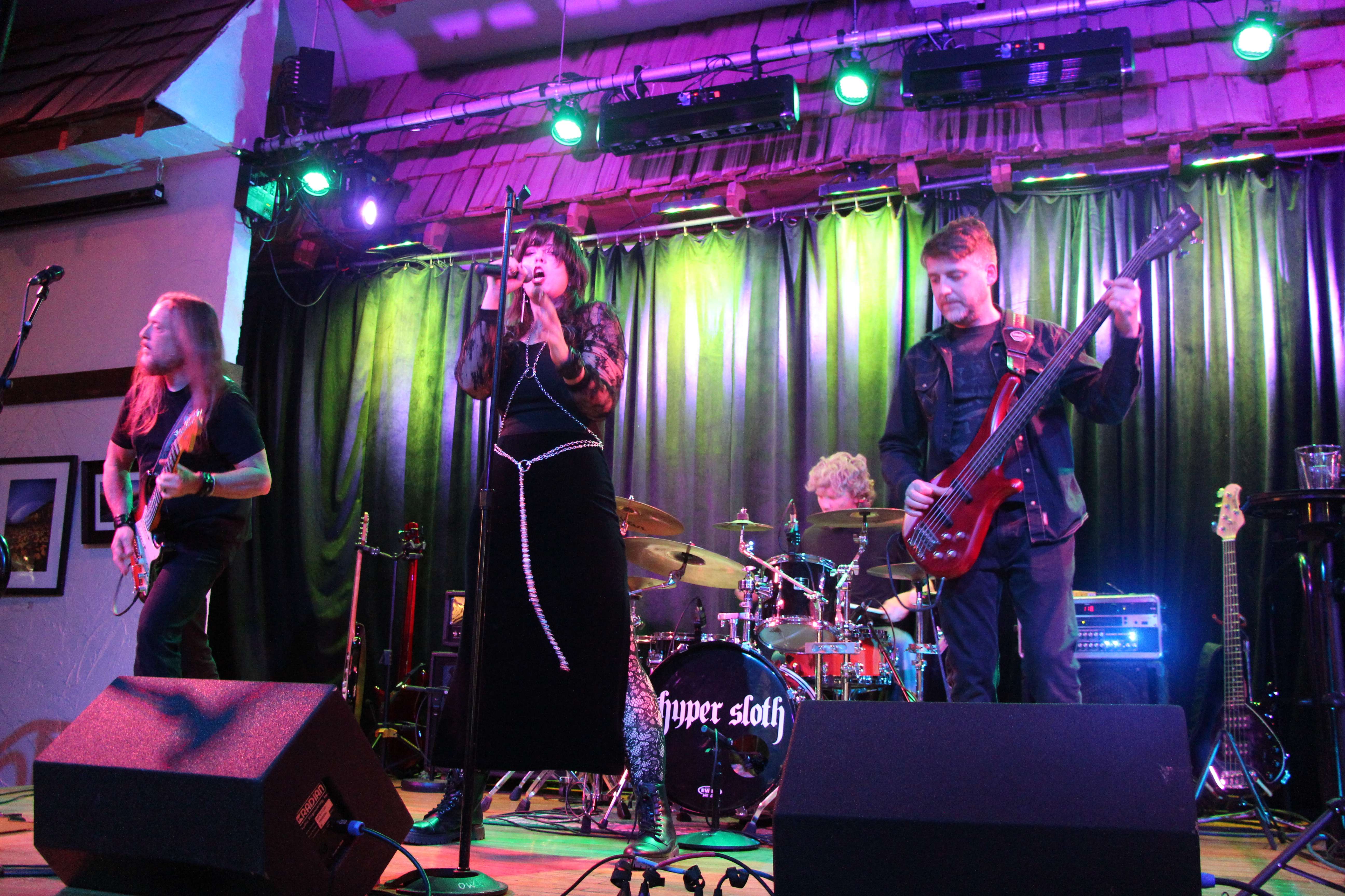 a group of people playing music on stage
