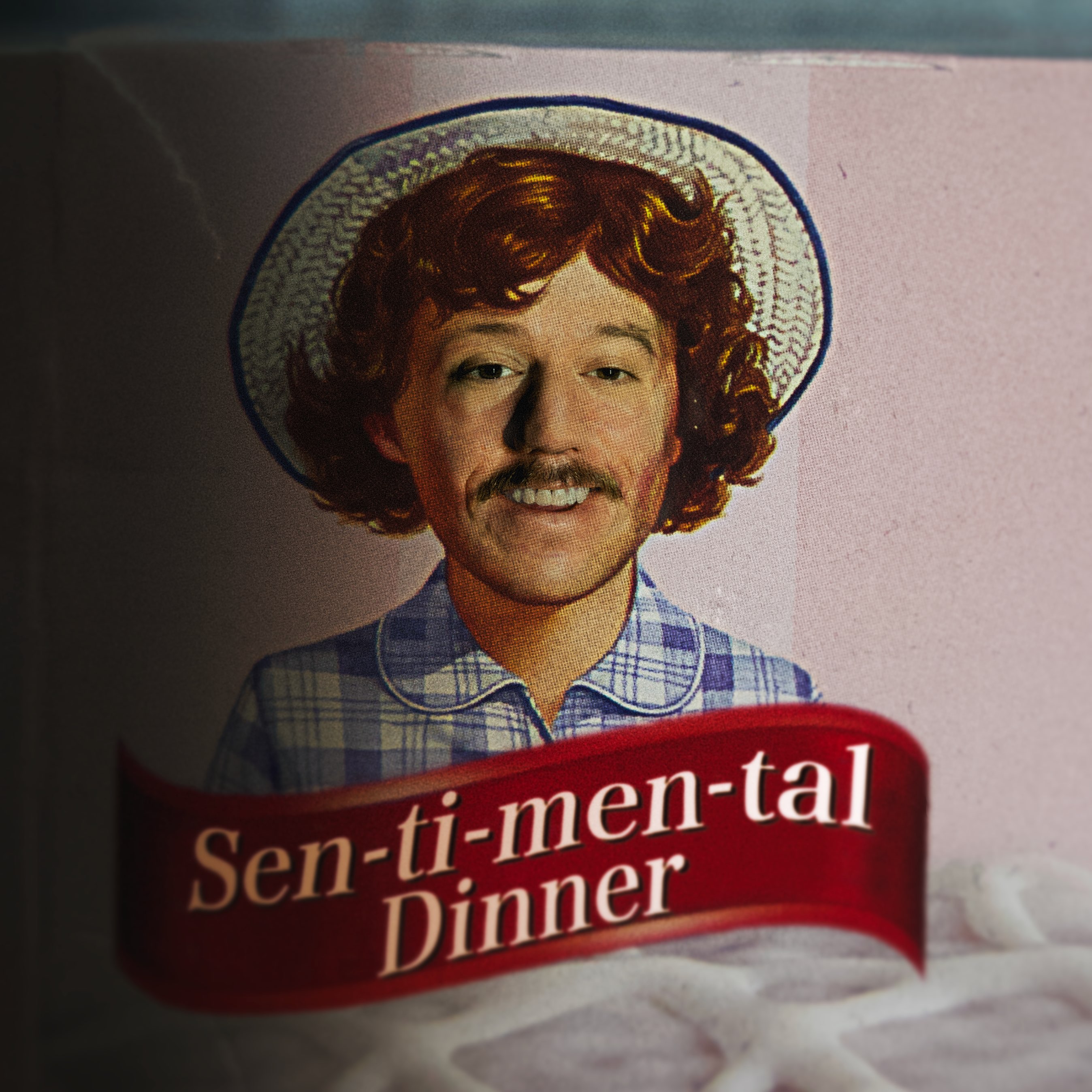 a box with a picture of a man in a hat