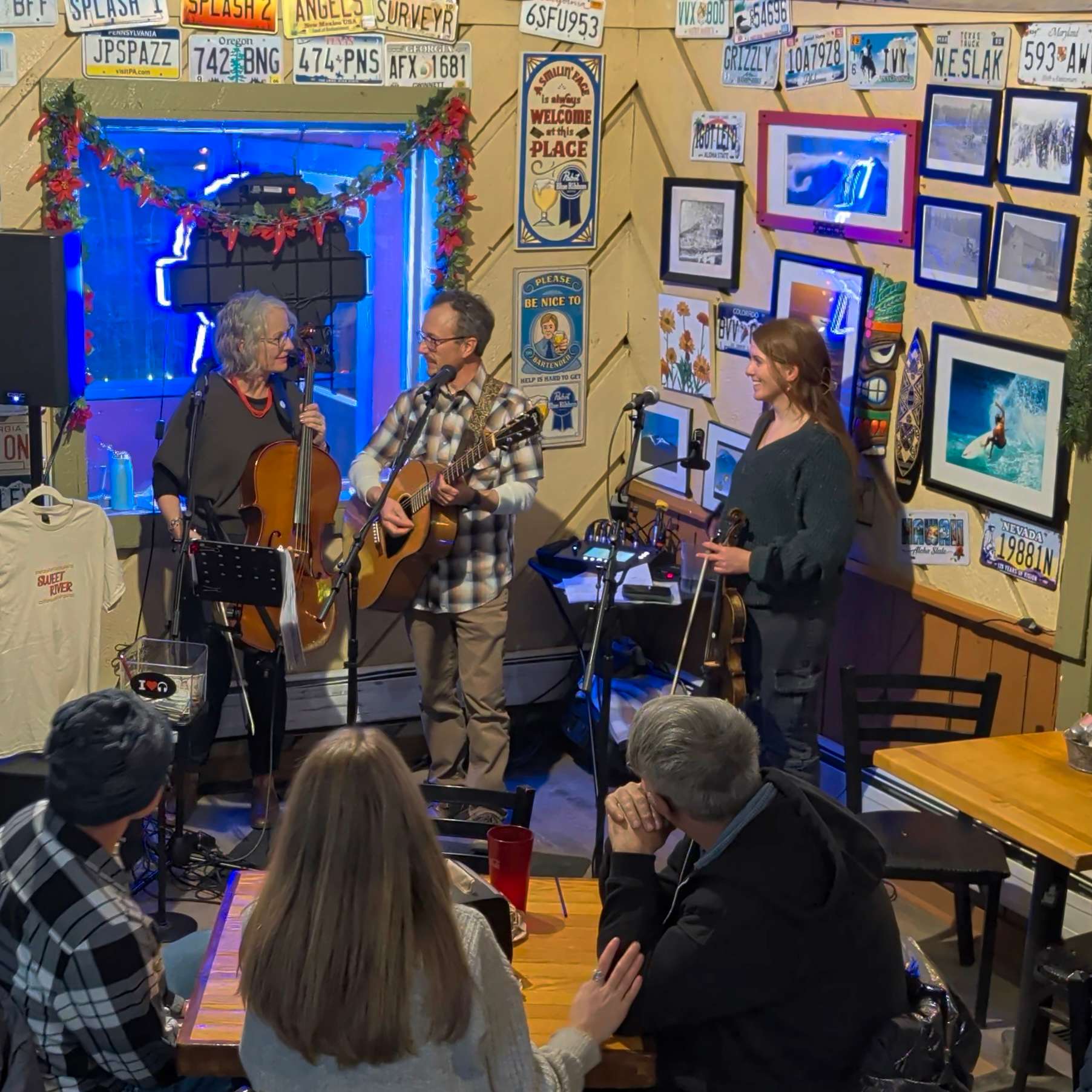 a group of people sitting at a table in a restaurant