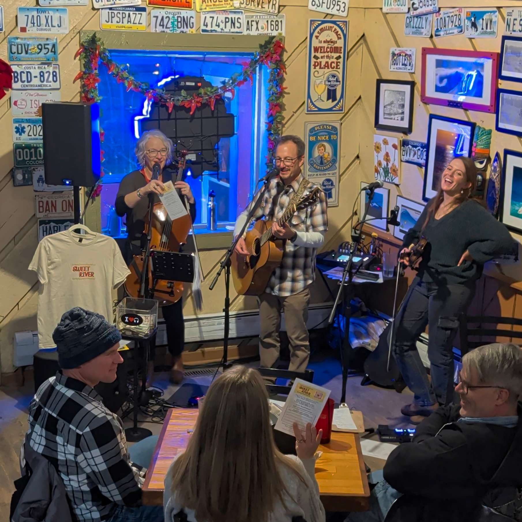 a group of people sitting at a table in a restaurant