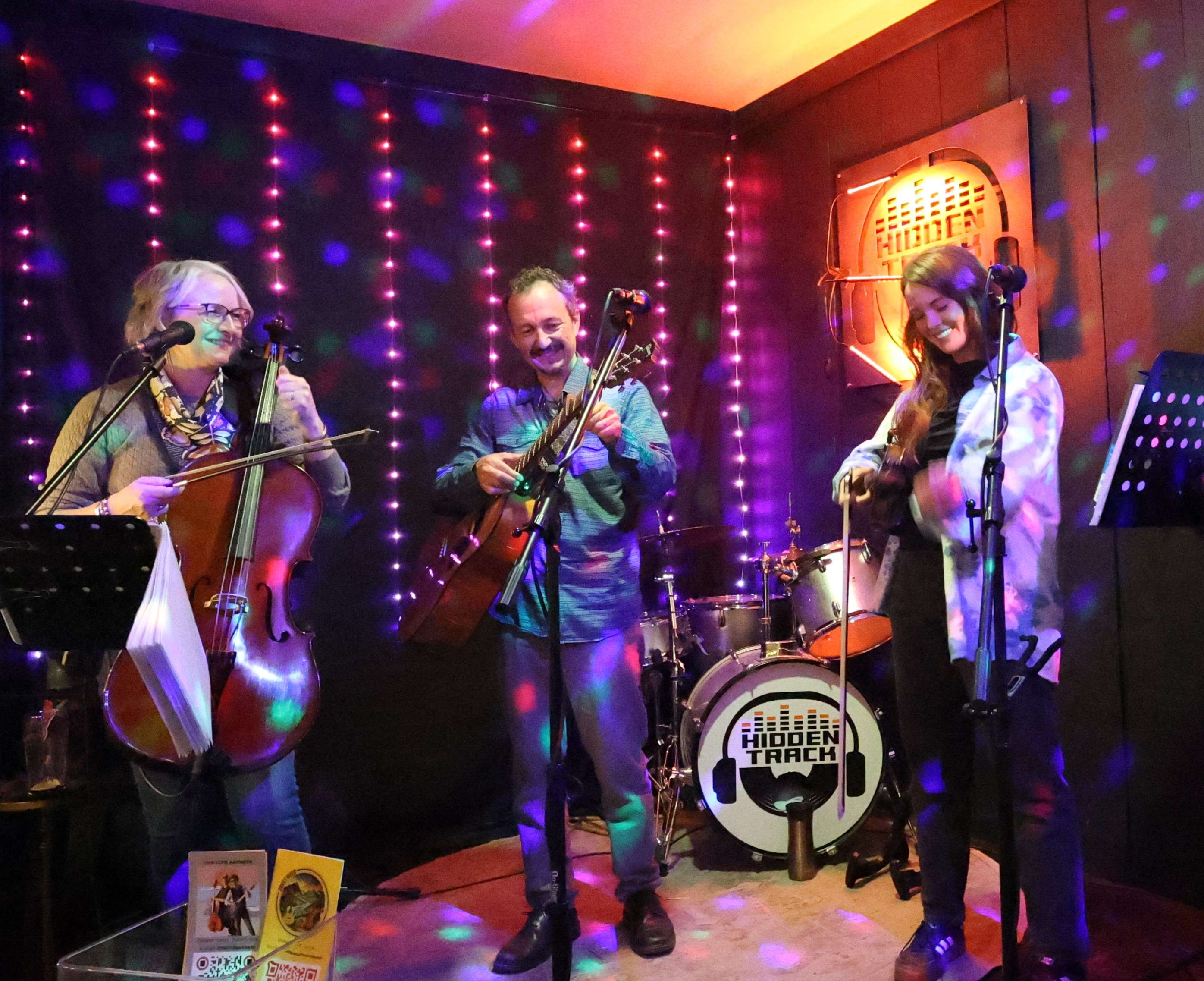 a group of people playing music in a room