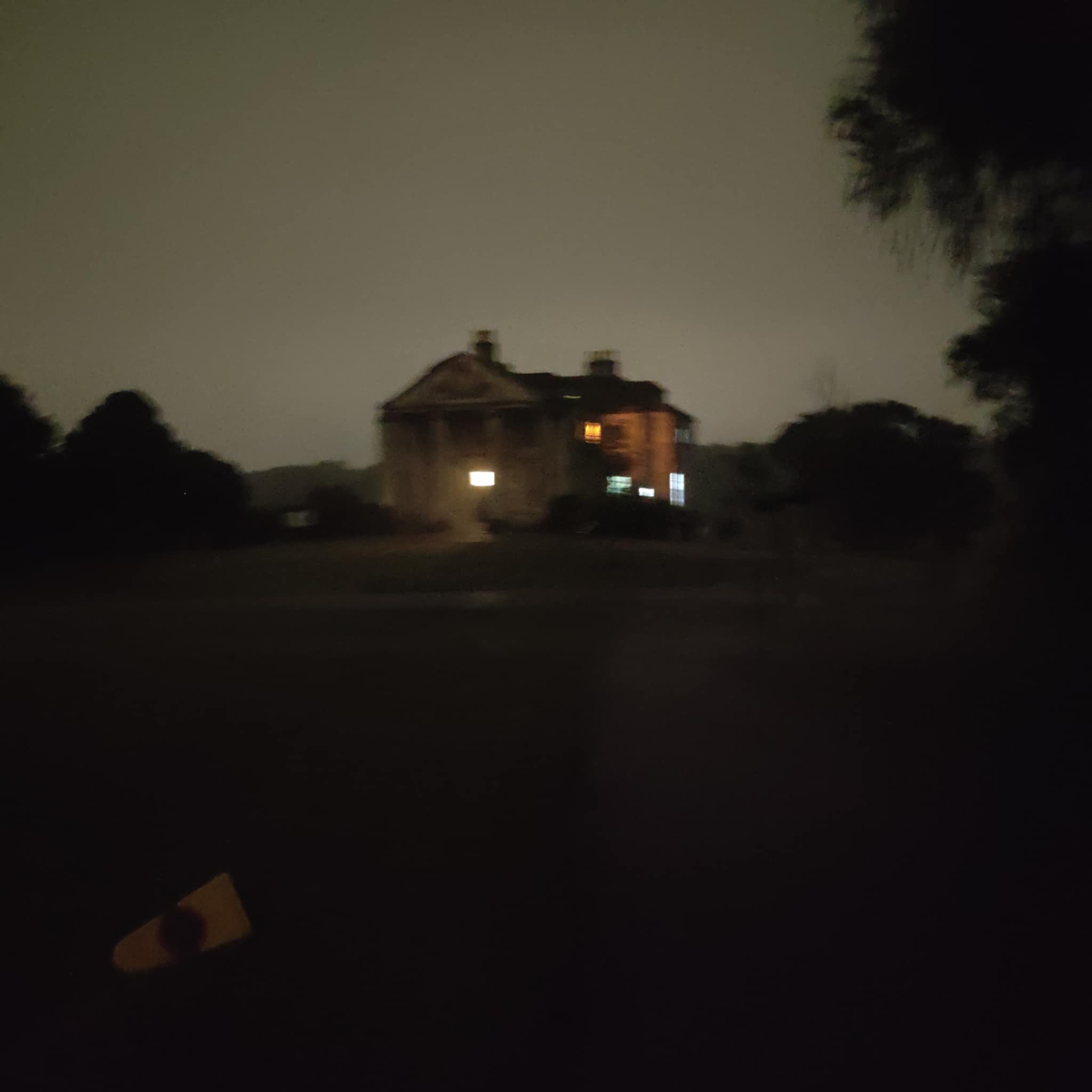 a blurry image of a house at night