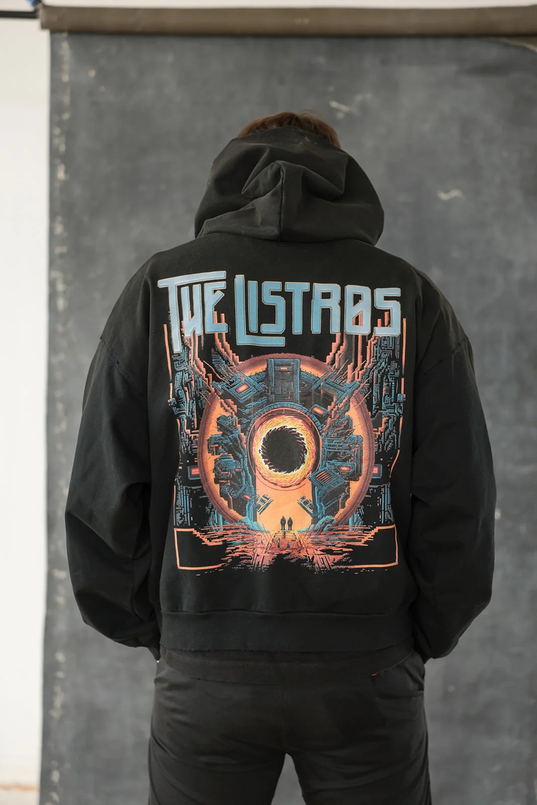 a man wearing a black hoodie with the words'the last basts'on it